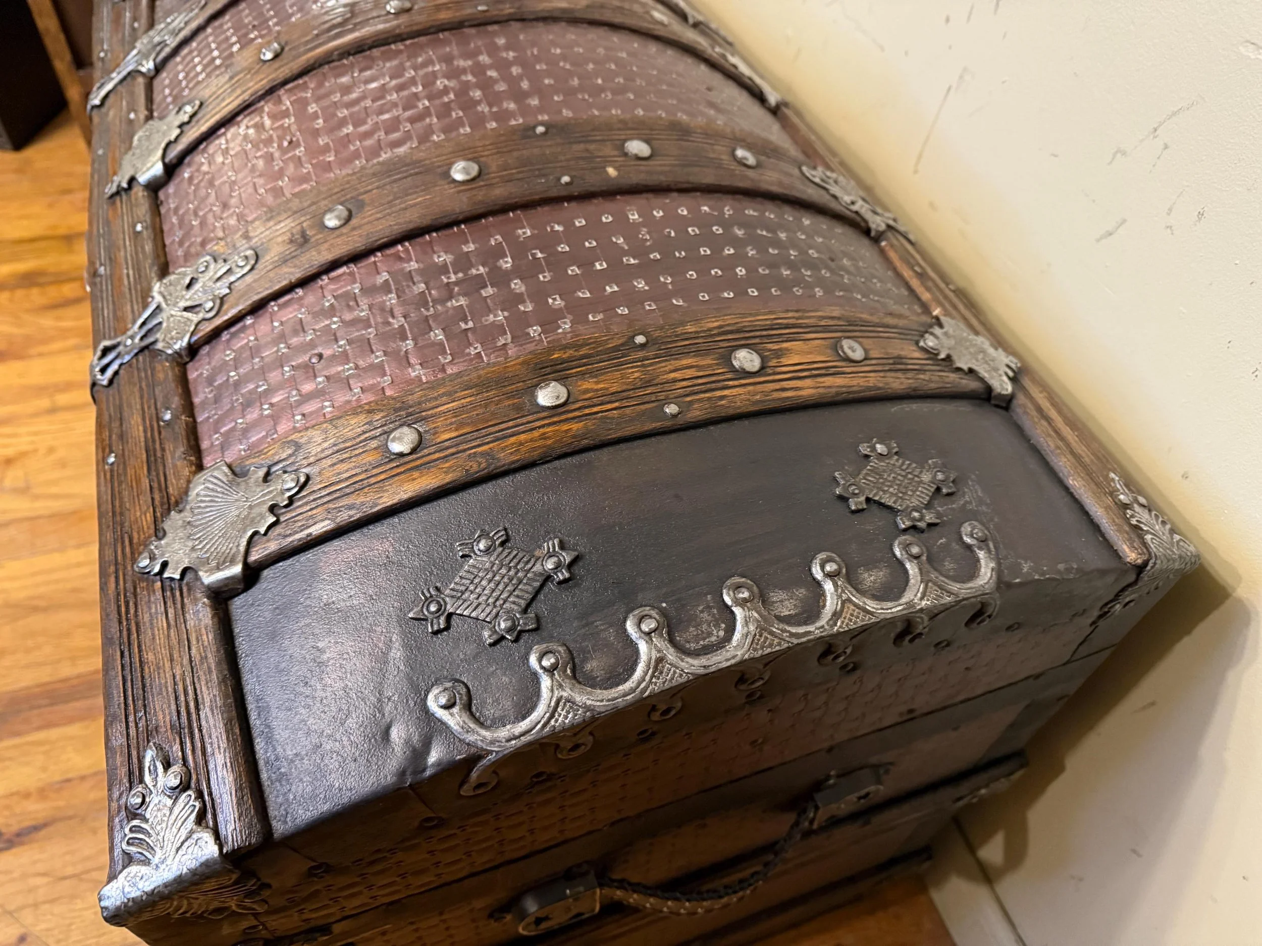 Macro shot of the color changing metallic shimmer on a rare embossed tin surface.