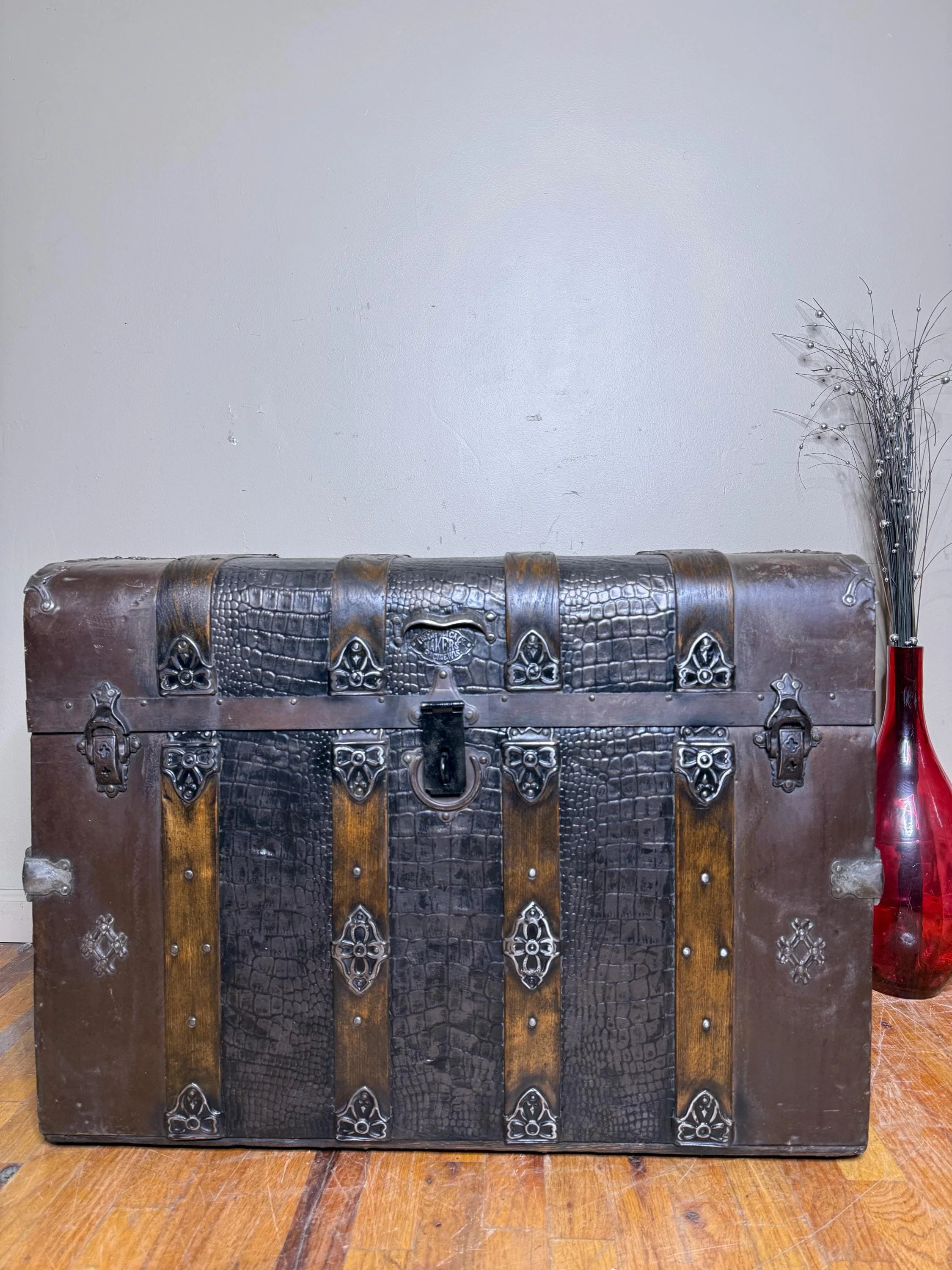 Antique monitor trunk styled as a luxury accent piece for a heritage home.