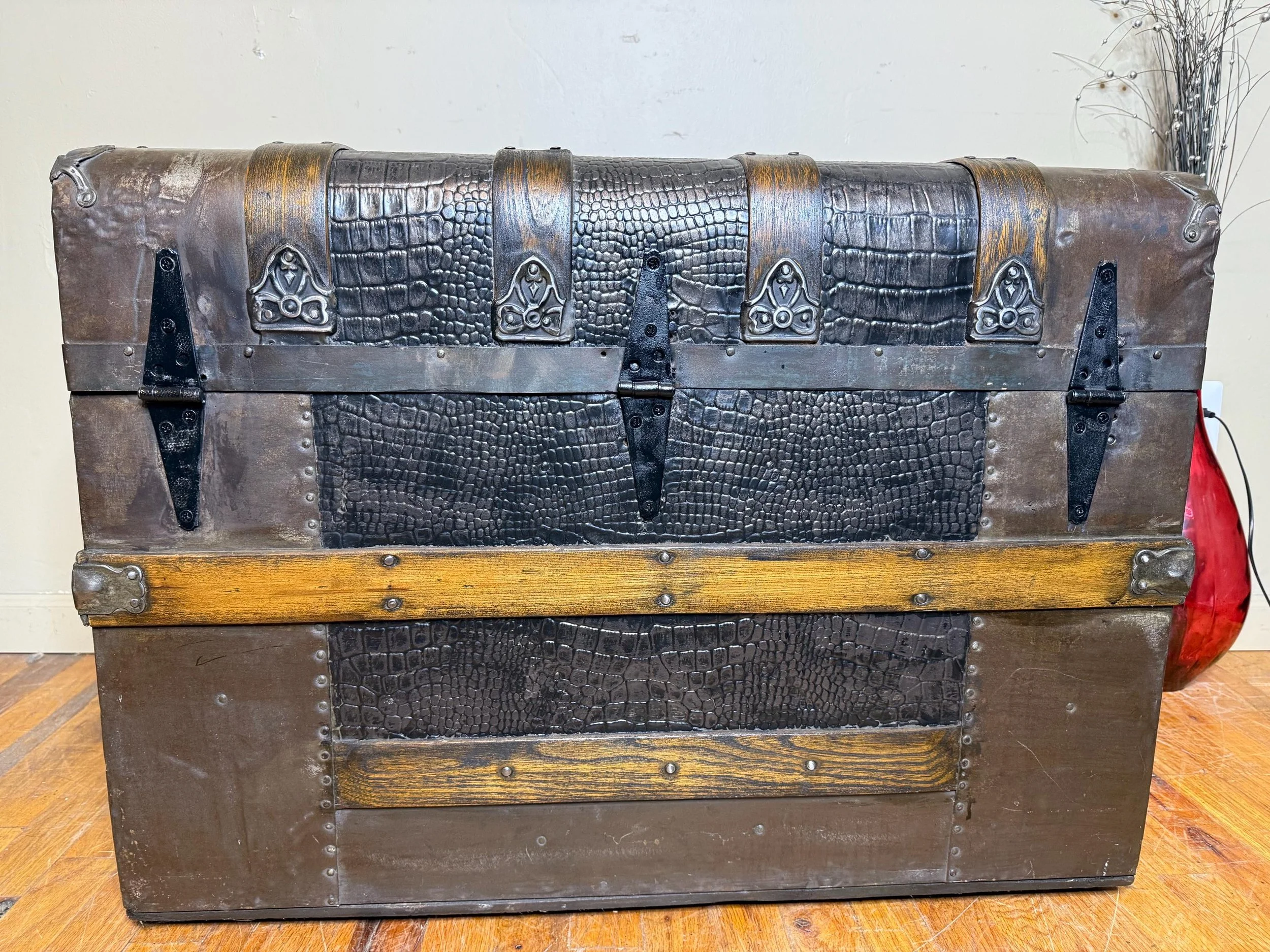 Rear view of the trunk showing three newly replaced heavy-duty metal hinges.