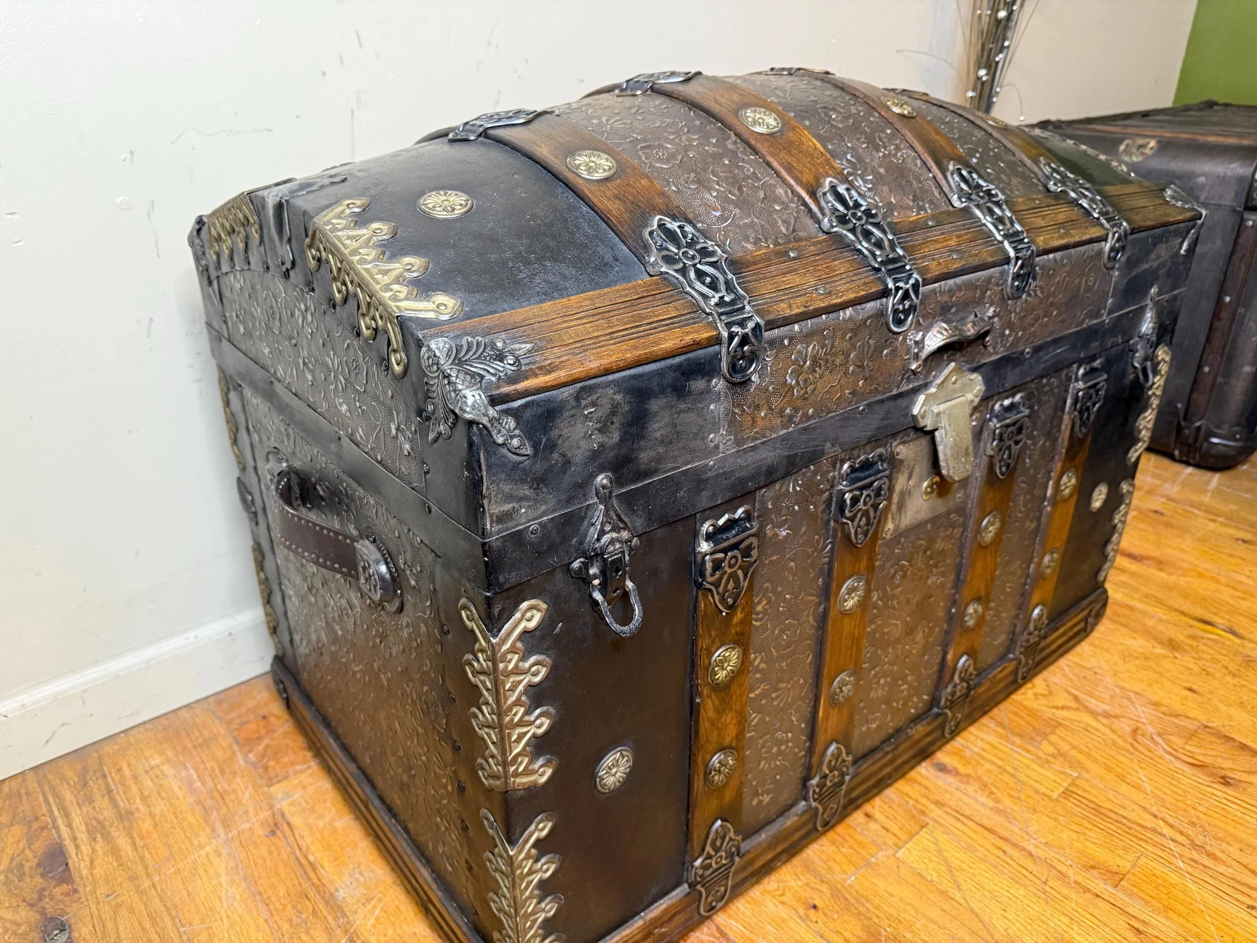 Angled profile of Victorian antique trunk with curved lid