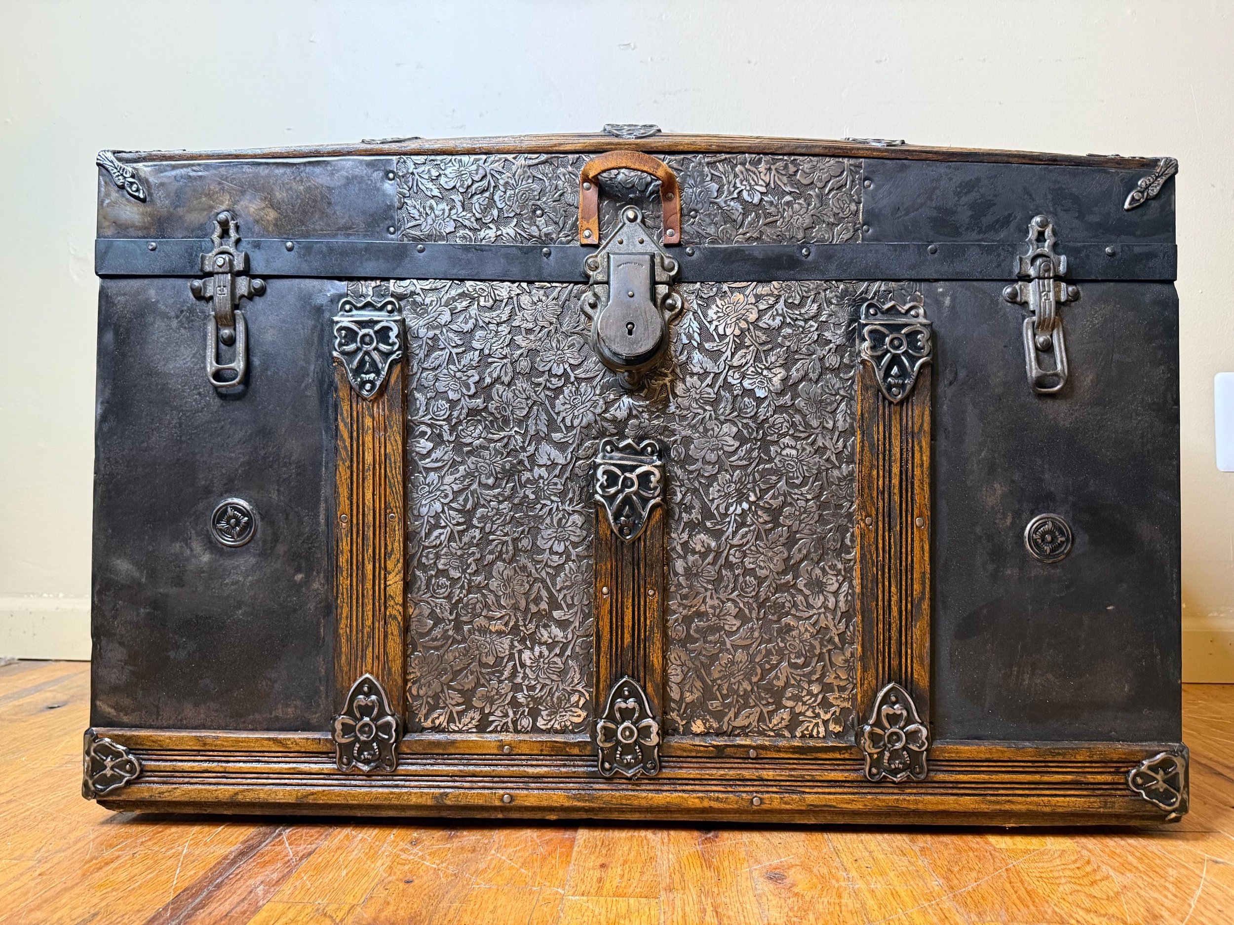 arge dome top trunk styled as a luxury bedroom storage focal point.