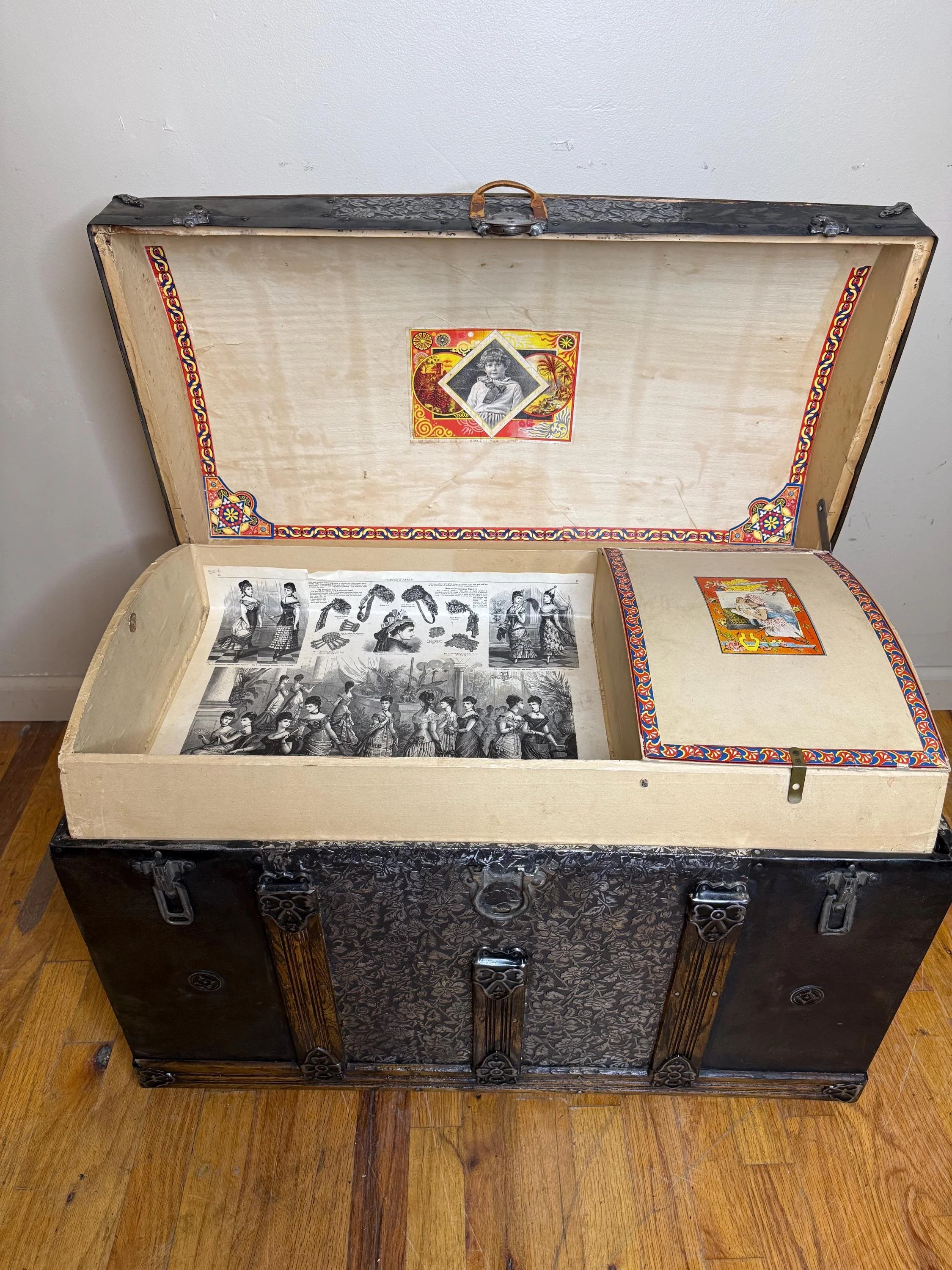 Original Victorian interior of a clean antique trunk in remarkably good condition.