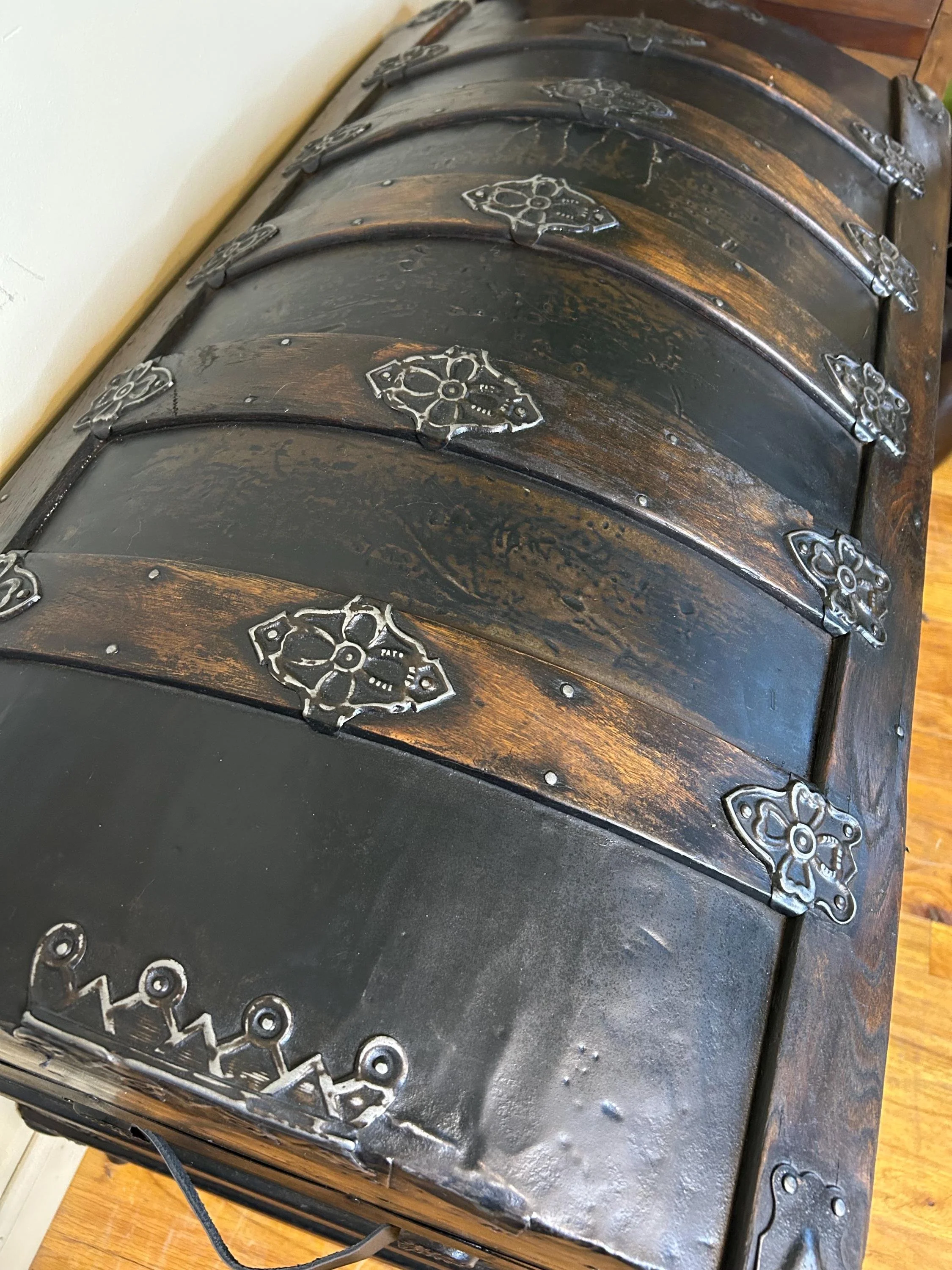 Close-up of antique trunk rivets and metal trim