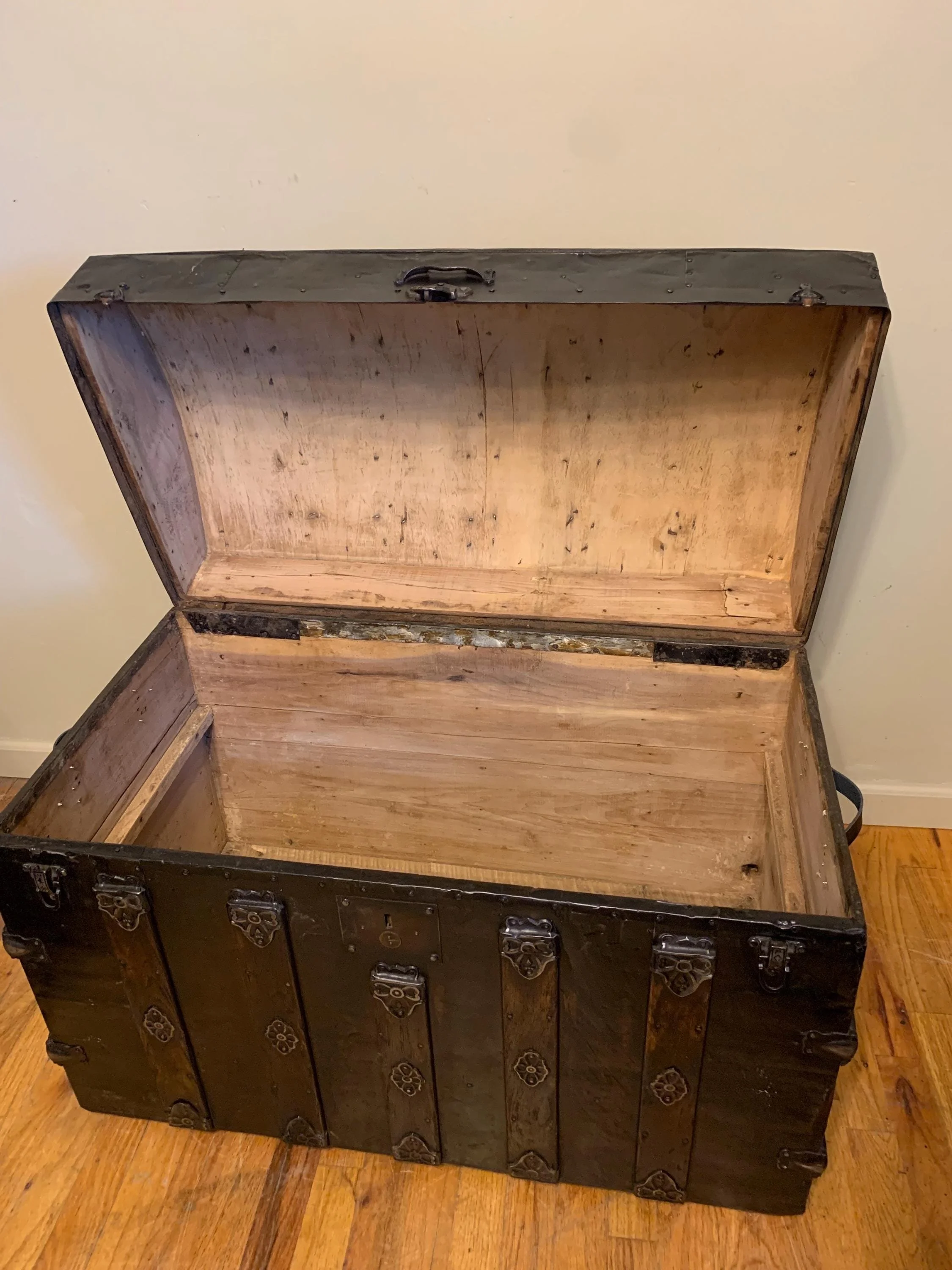 Interior of vintage travel chest stripped and sanded