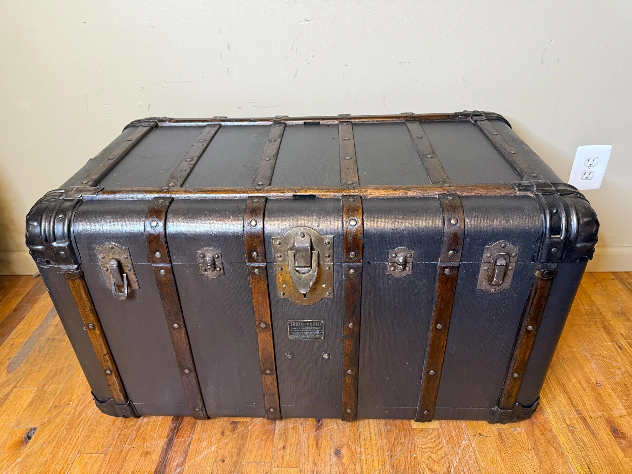 Metallic brown restored exterior on antique steamer trunk