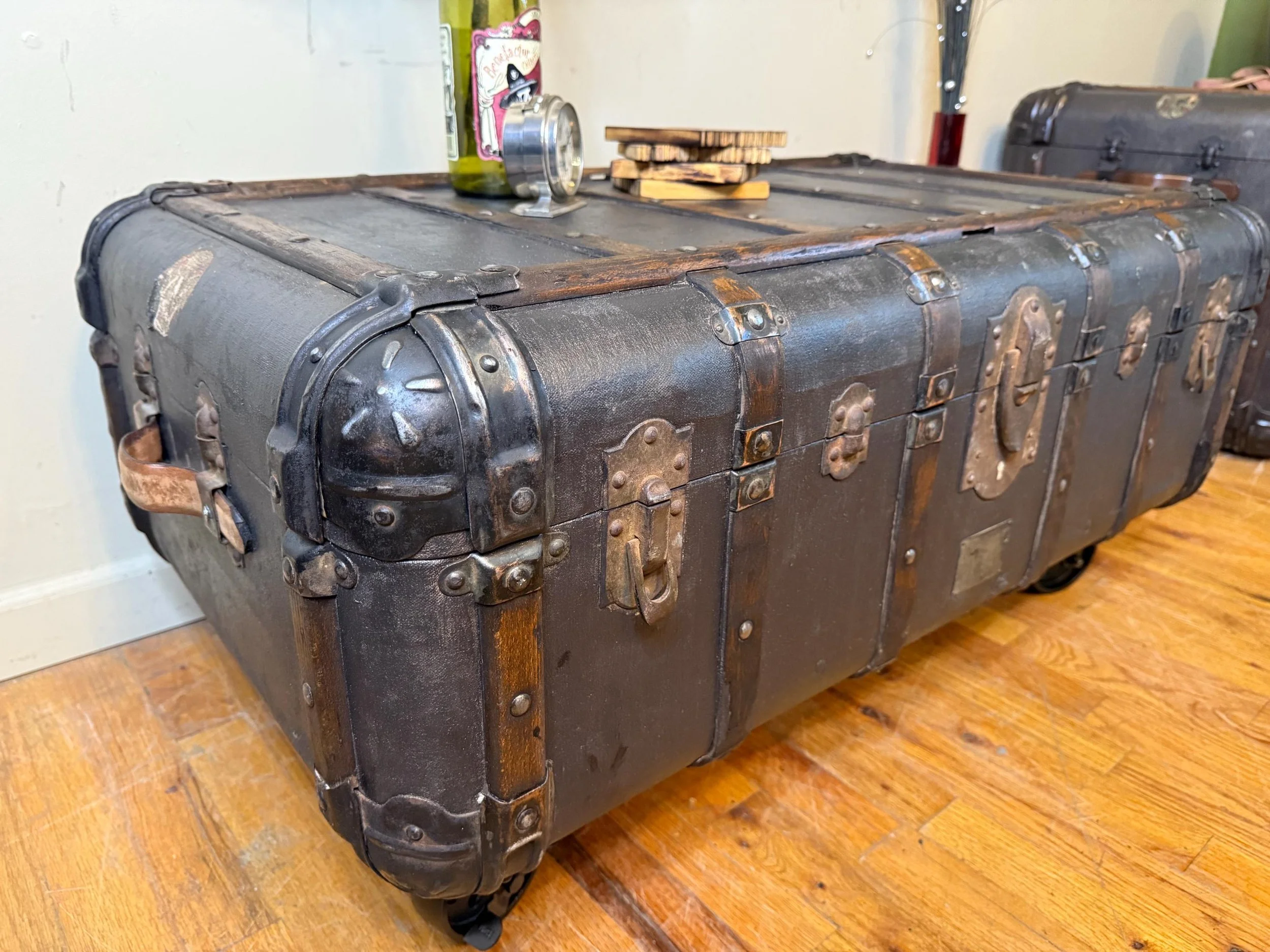Industrial style coffee table made from an authentic 1900s Indestructo trunk.