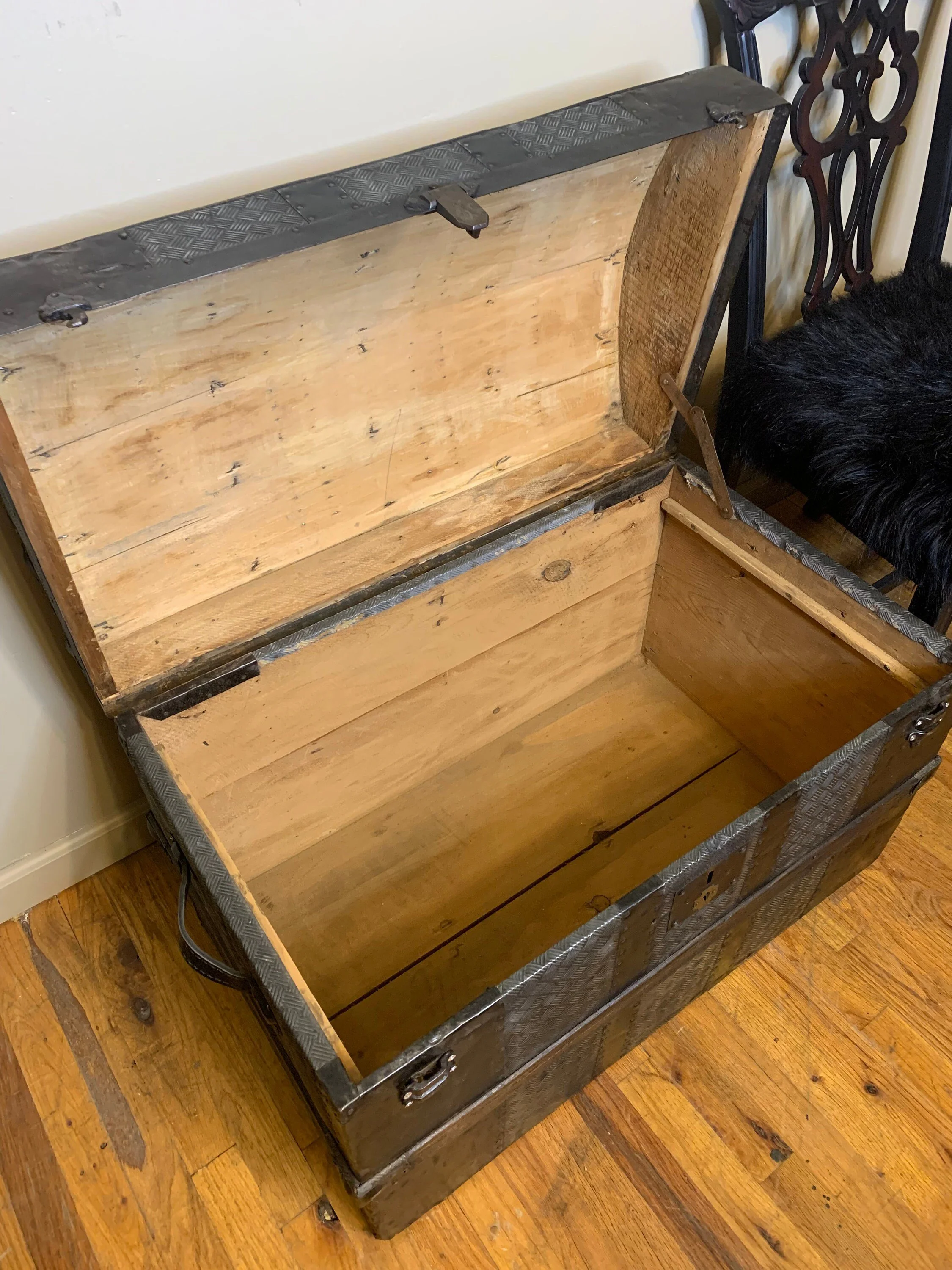 Restored interior of antique travel steamer trunk