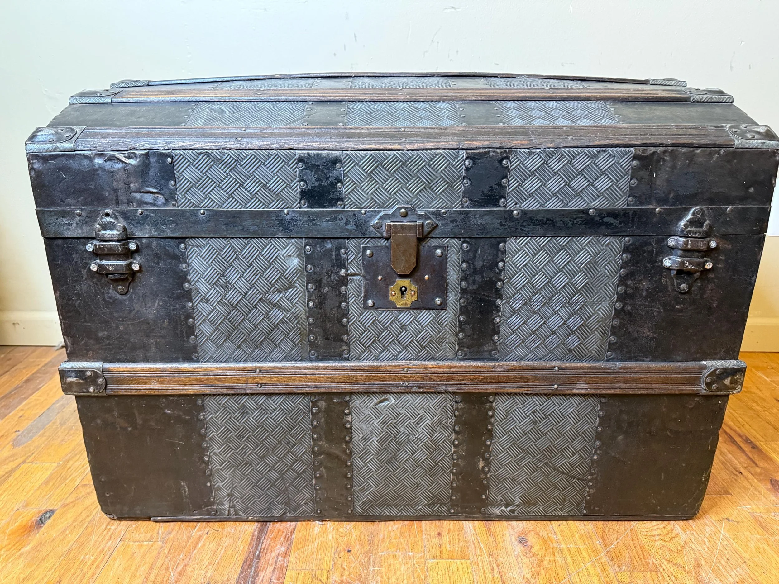 Vintage trunk with automotive-inspired embossed tin pattern