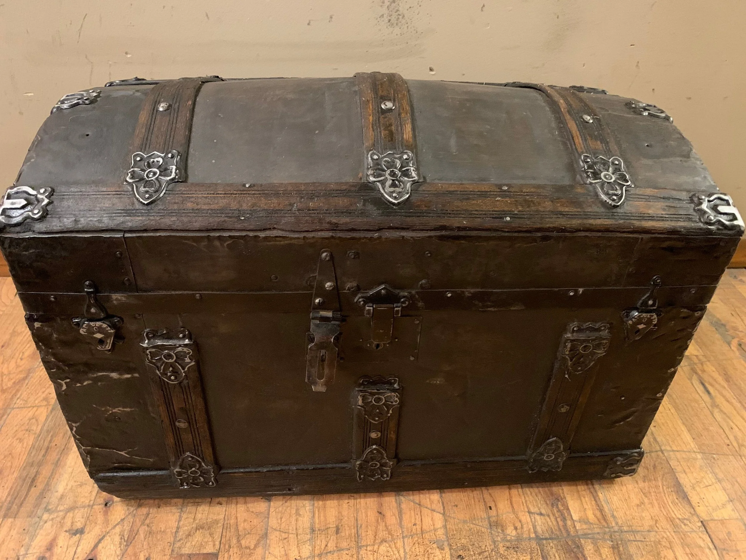 Antique travel trunk with Jacobean stained wood slats