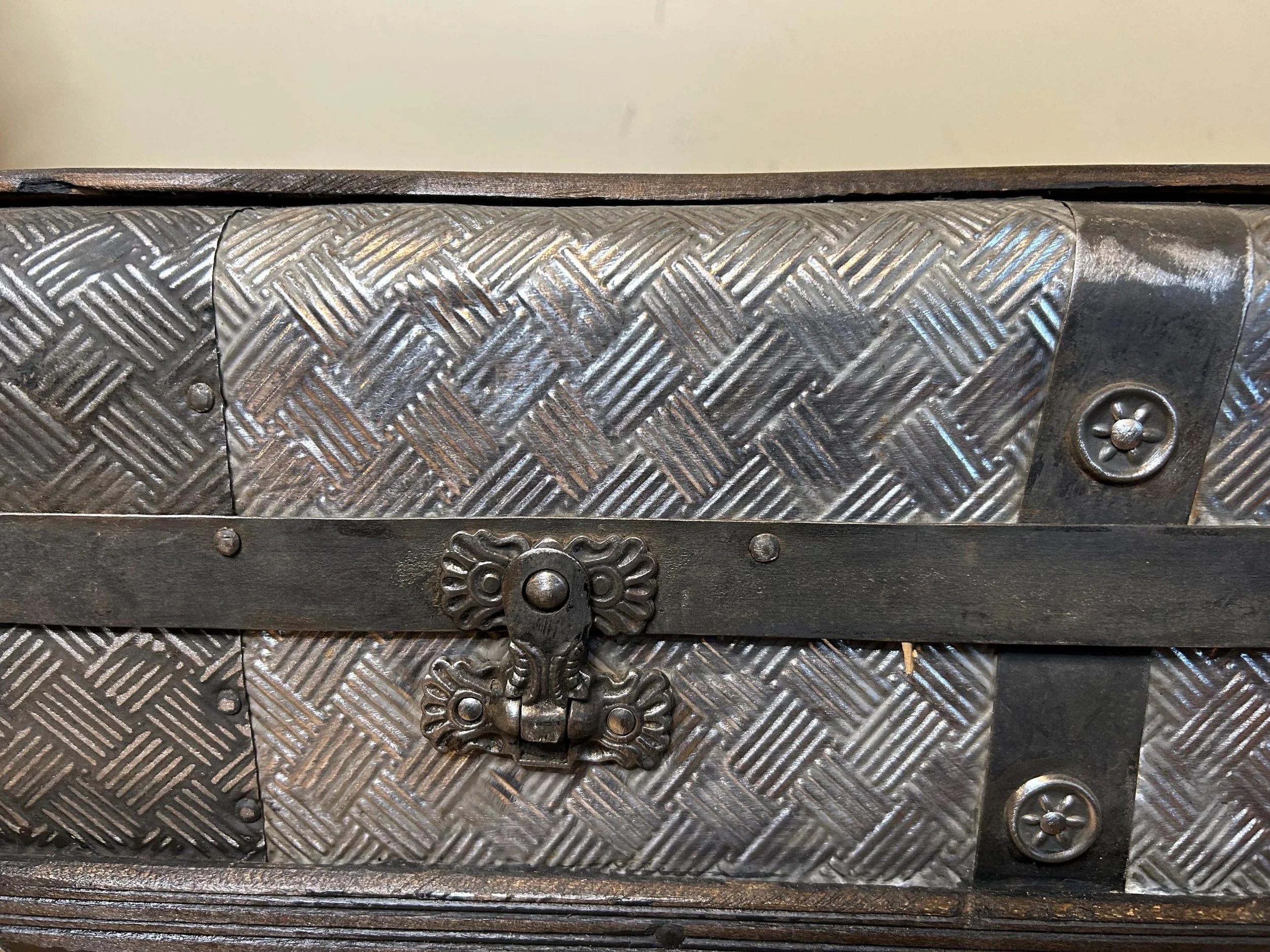 Closeup of original hardware on small vintage steamer trunk