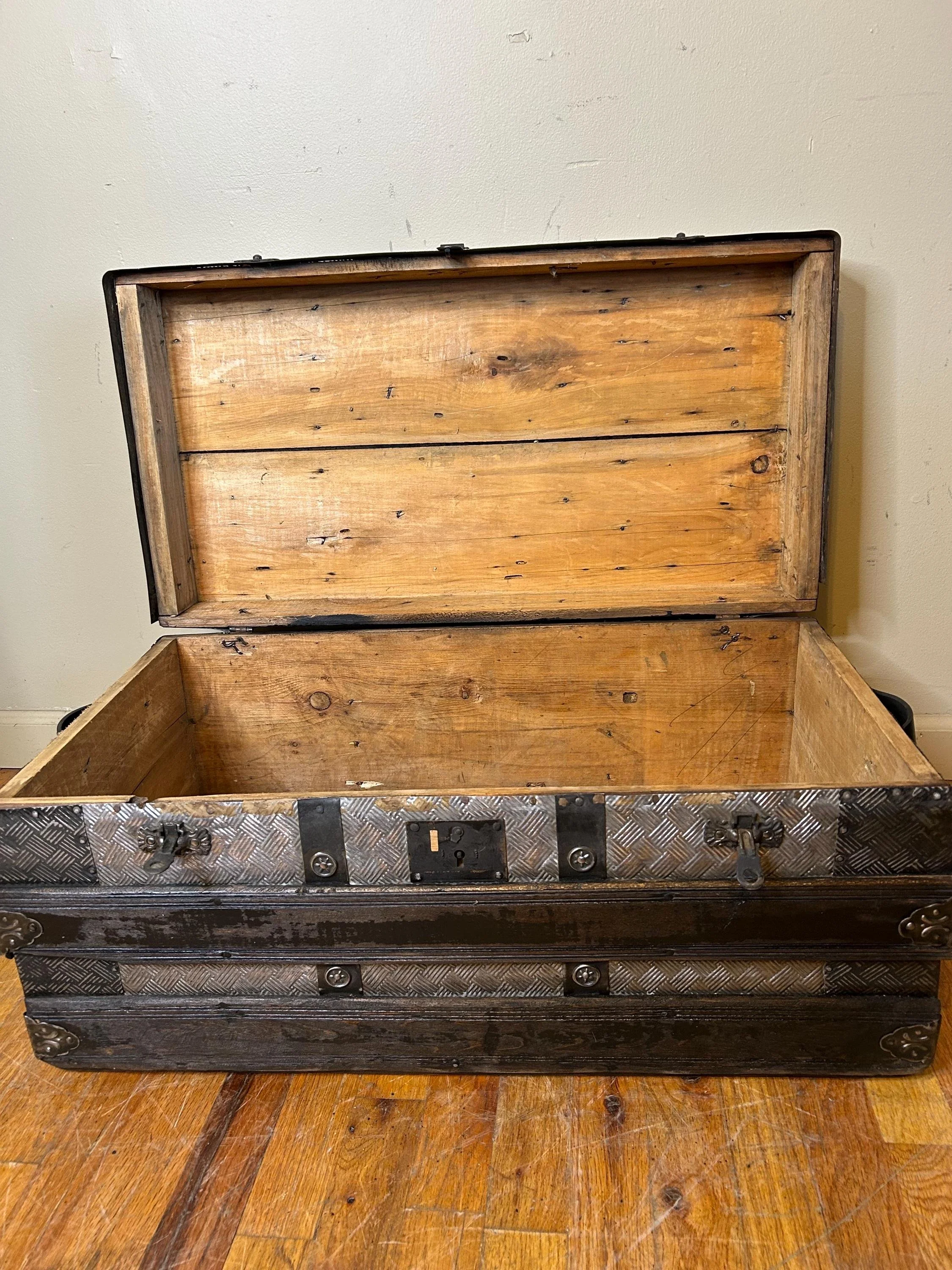 Clean restored interior of antique keepsake steamer trunk
