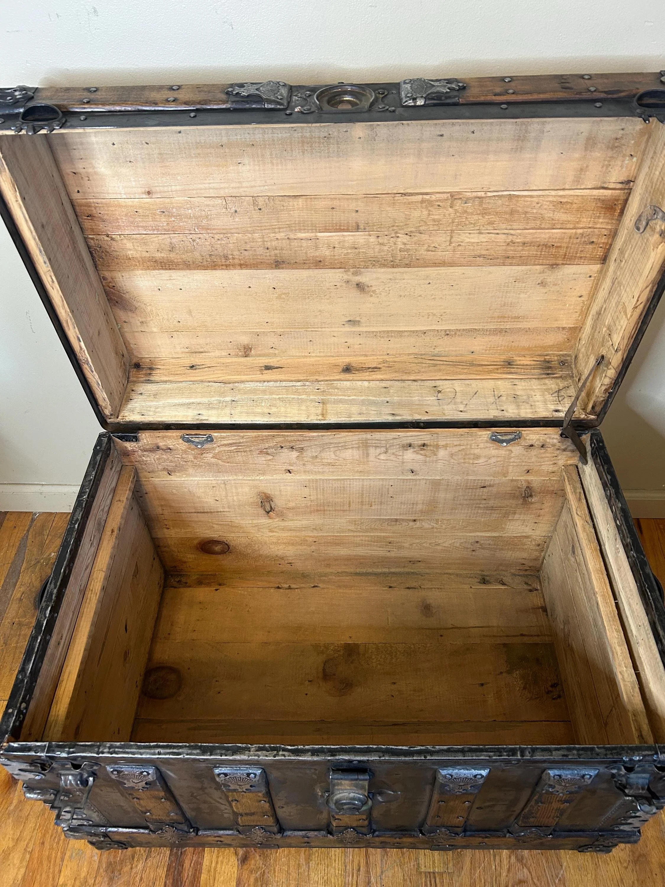 Inside view of a super clean, odor-free antique trunk ready for storage.