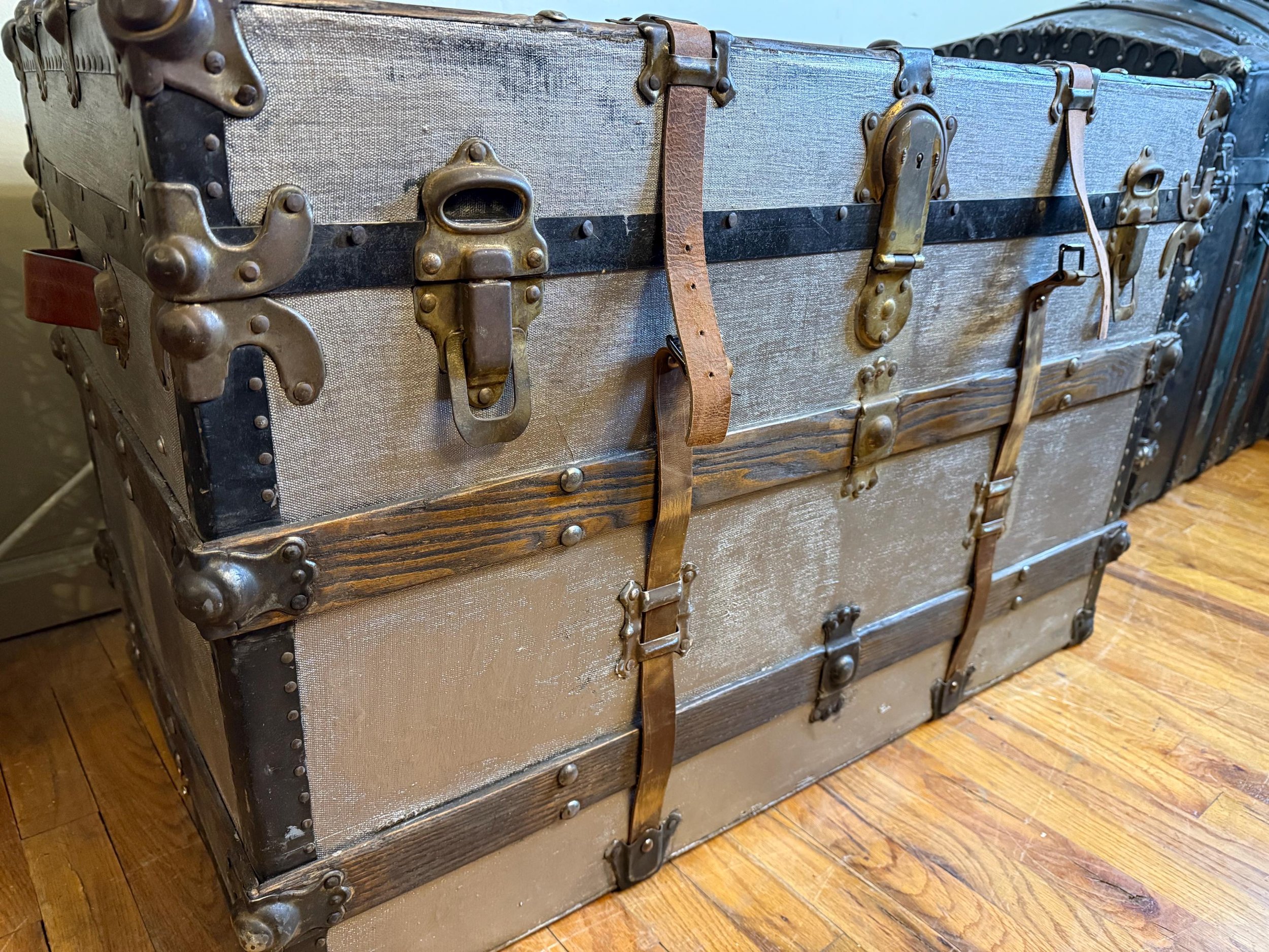 Authentic 19th-century trunk reimagined with a metallic finish and secret storage.