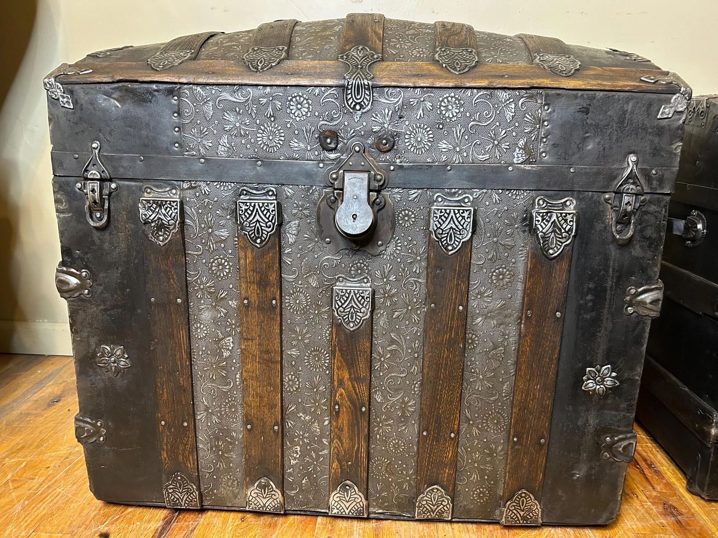 Large floral luxury keepsake box used as an elegant focal point in a master bedroom.