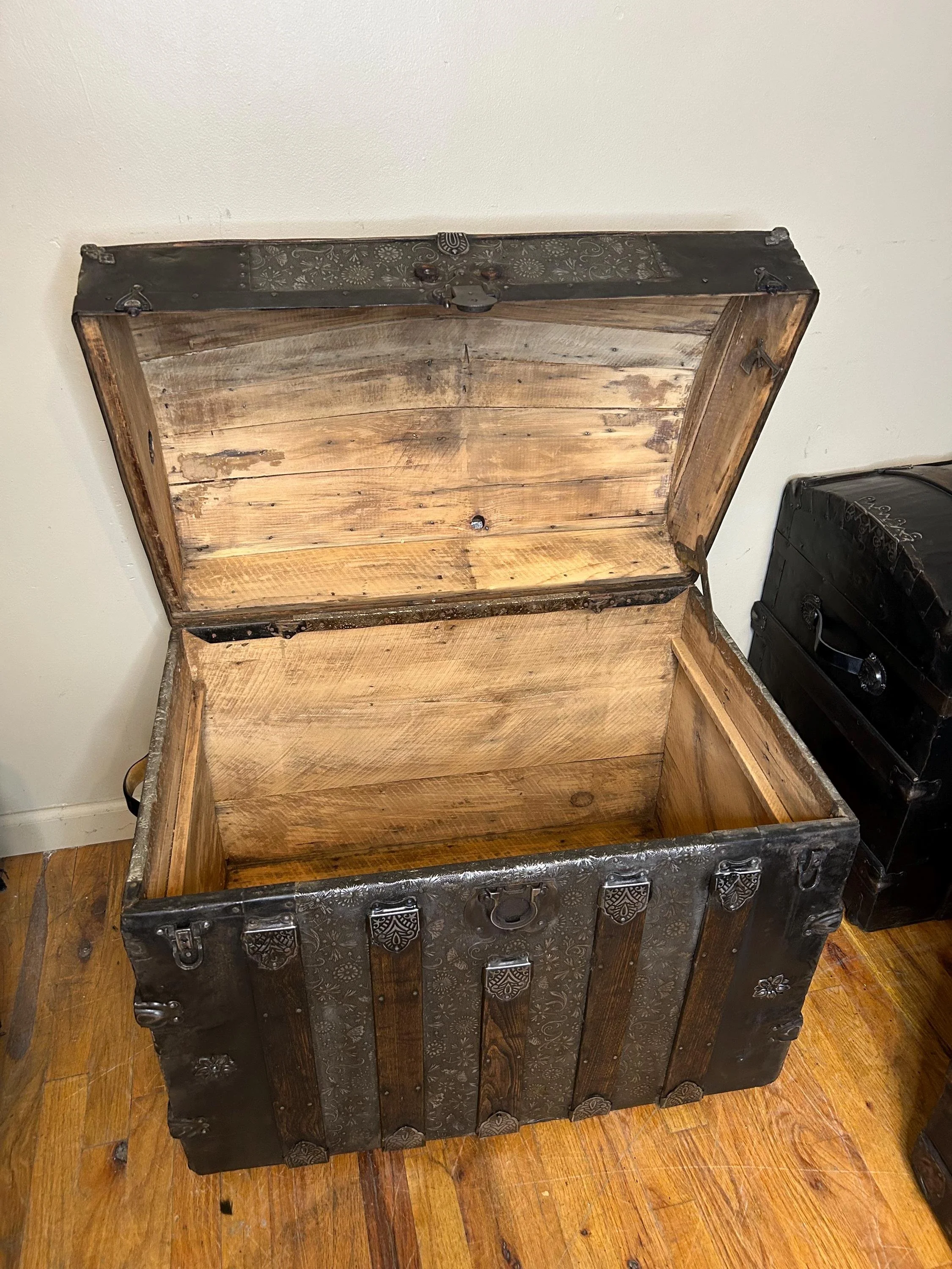 Inside view of a pristine, sanded wood interior of a clean antique storage chest