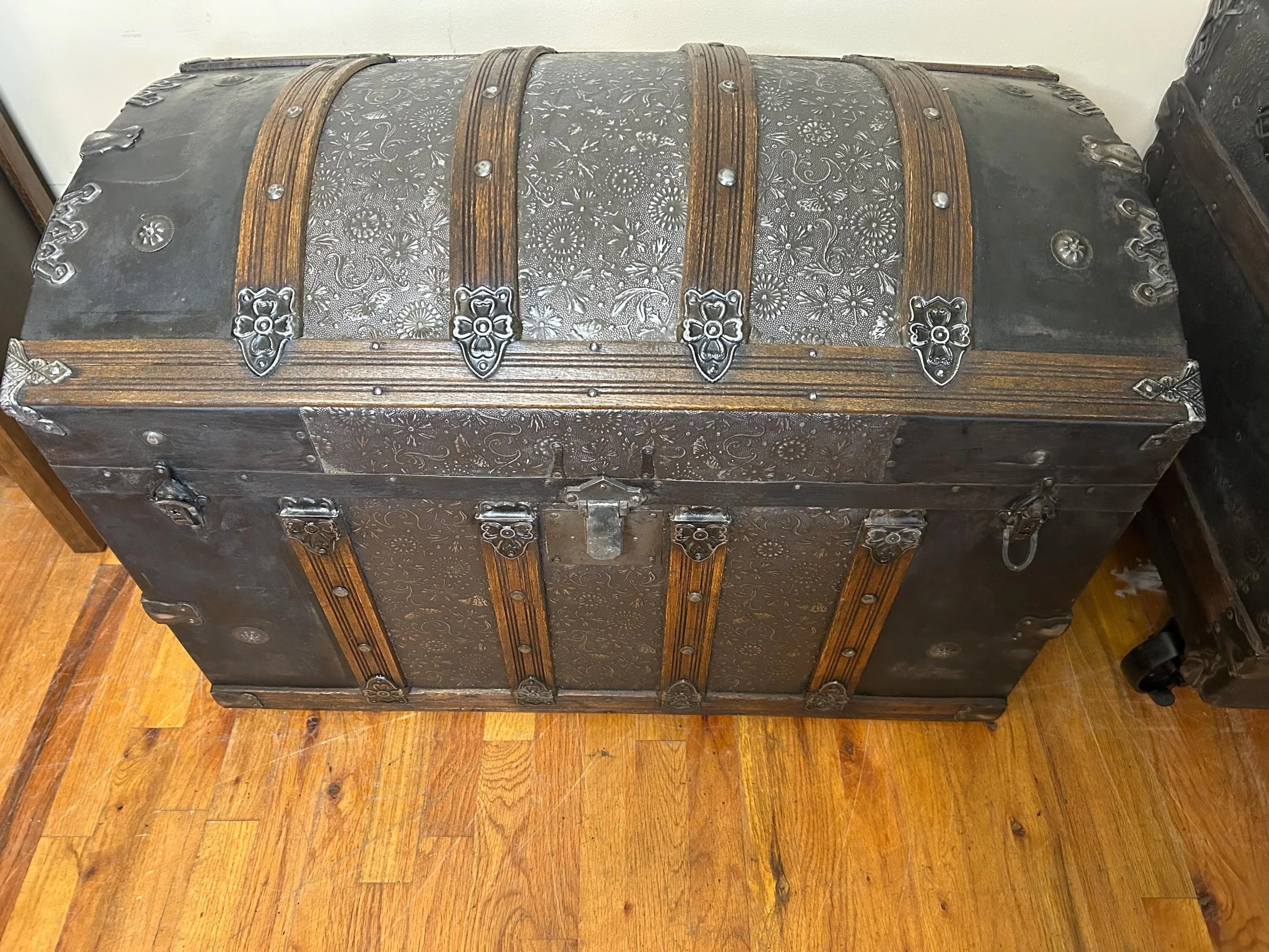 Antique travel luggage repurposed as a functional treasure chest and statement piece.