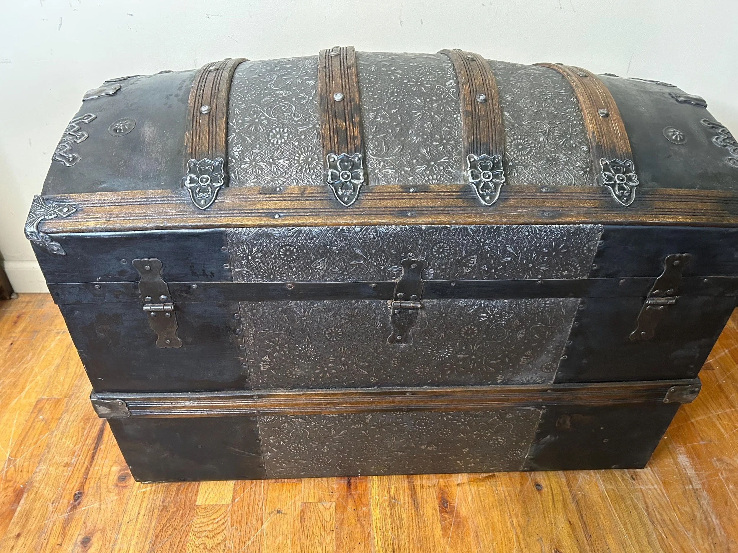 Refined walnut finish on solid oak wood slats of a restored heritage trunk.