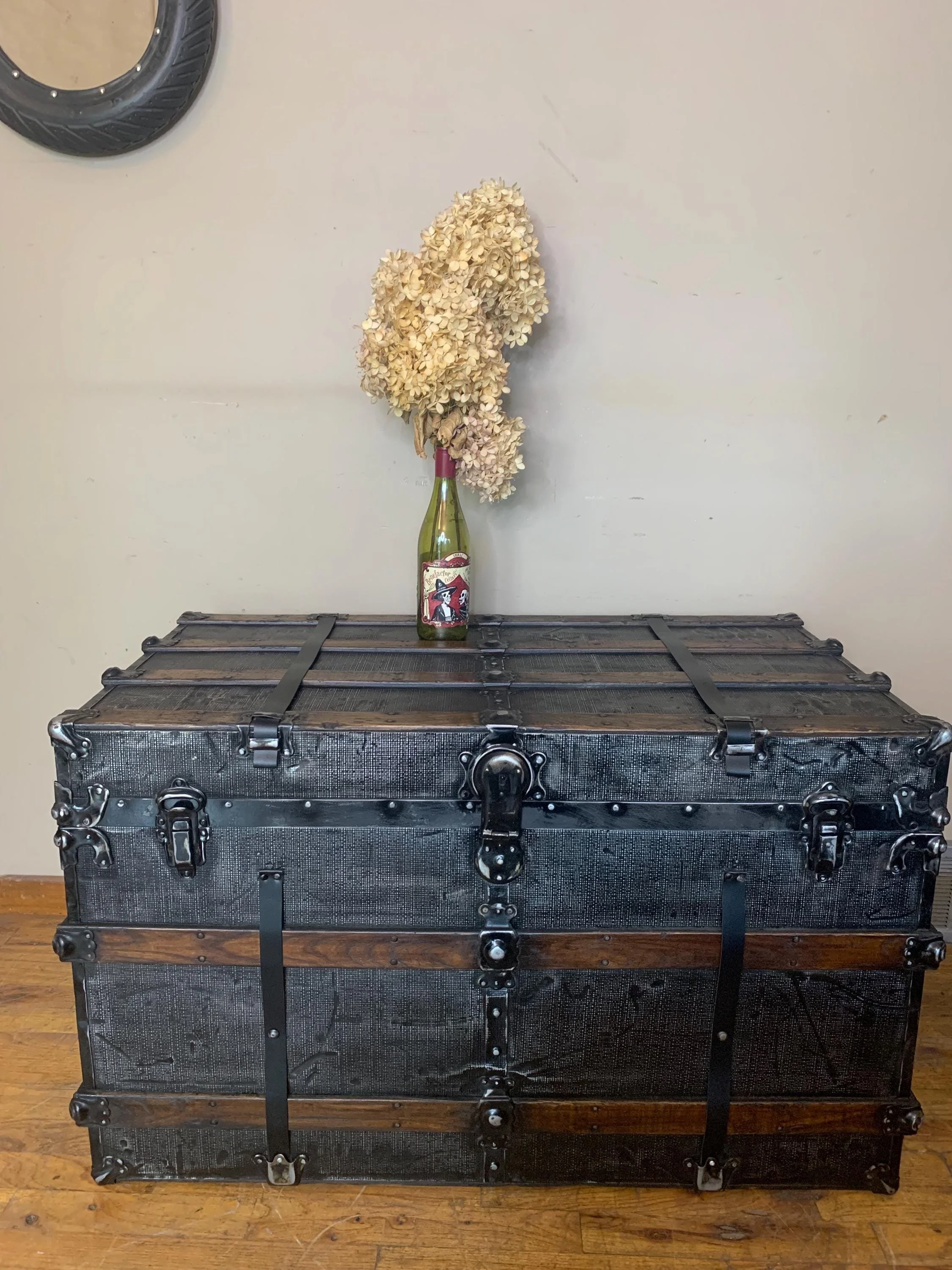 Huge refinished antique steamer trunk in black with rare embossed tin pattern
