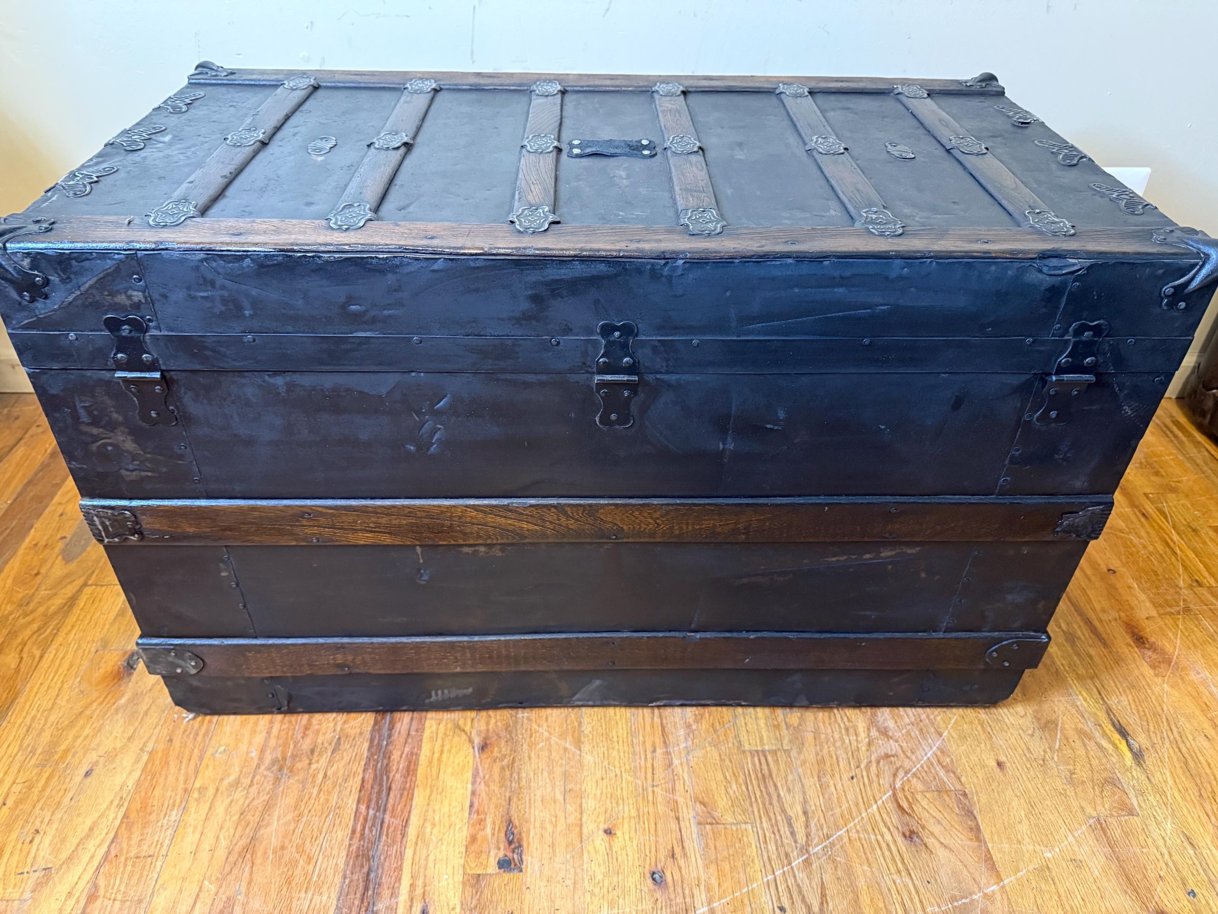 Extra-large vintage blanket chest used for luxury bedroom storage and decor.