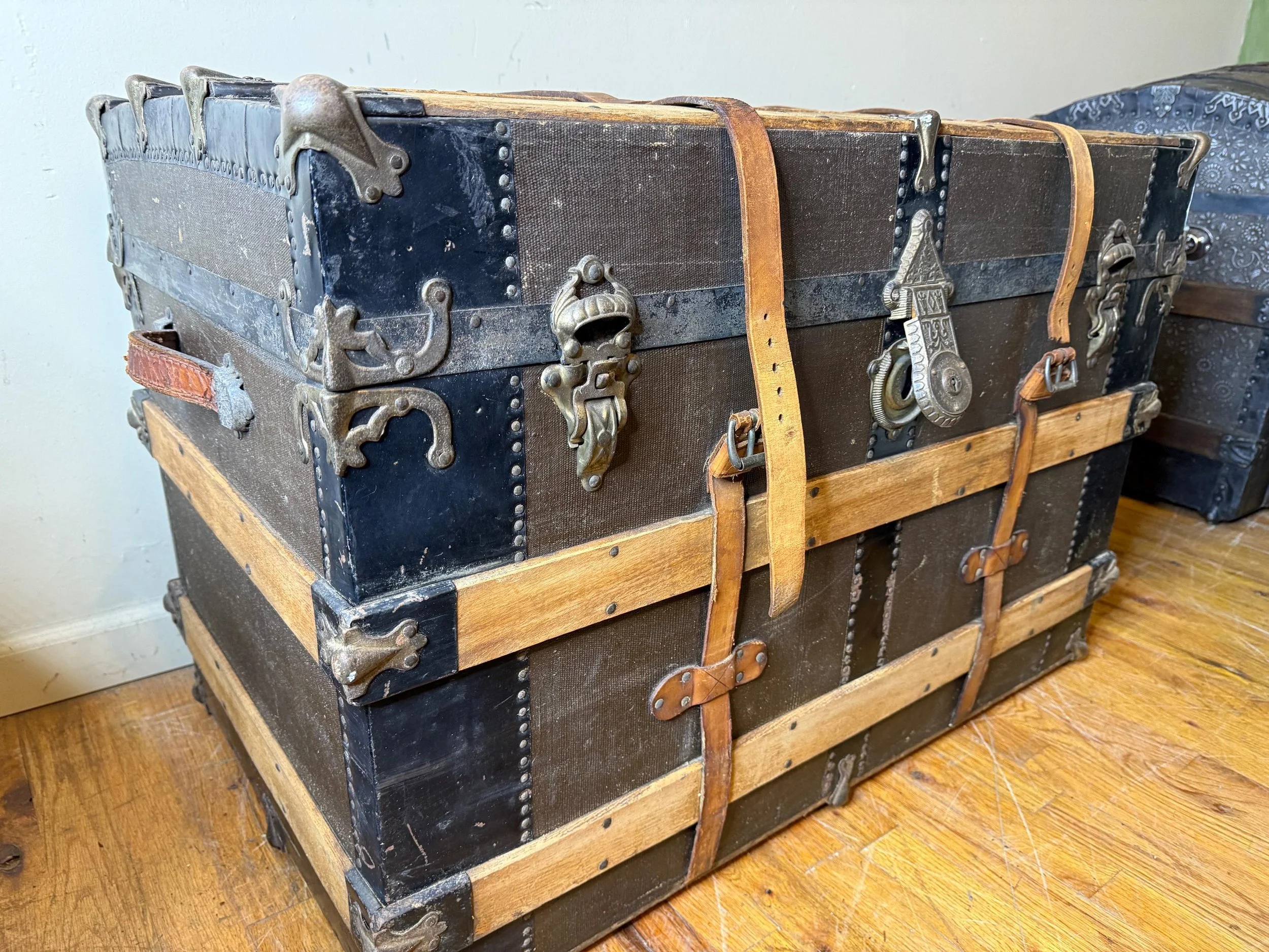 Side profile of a 34-inch wide flat top antique storage trunk