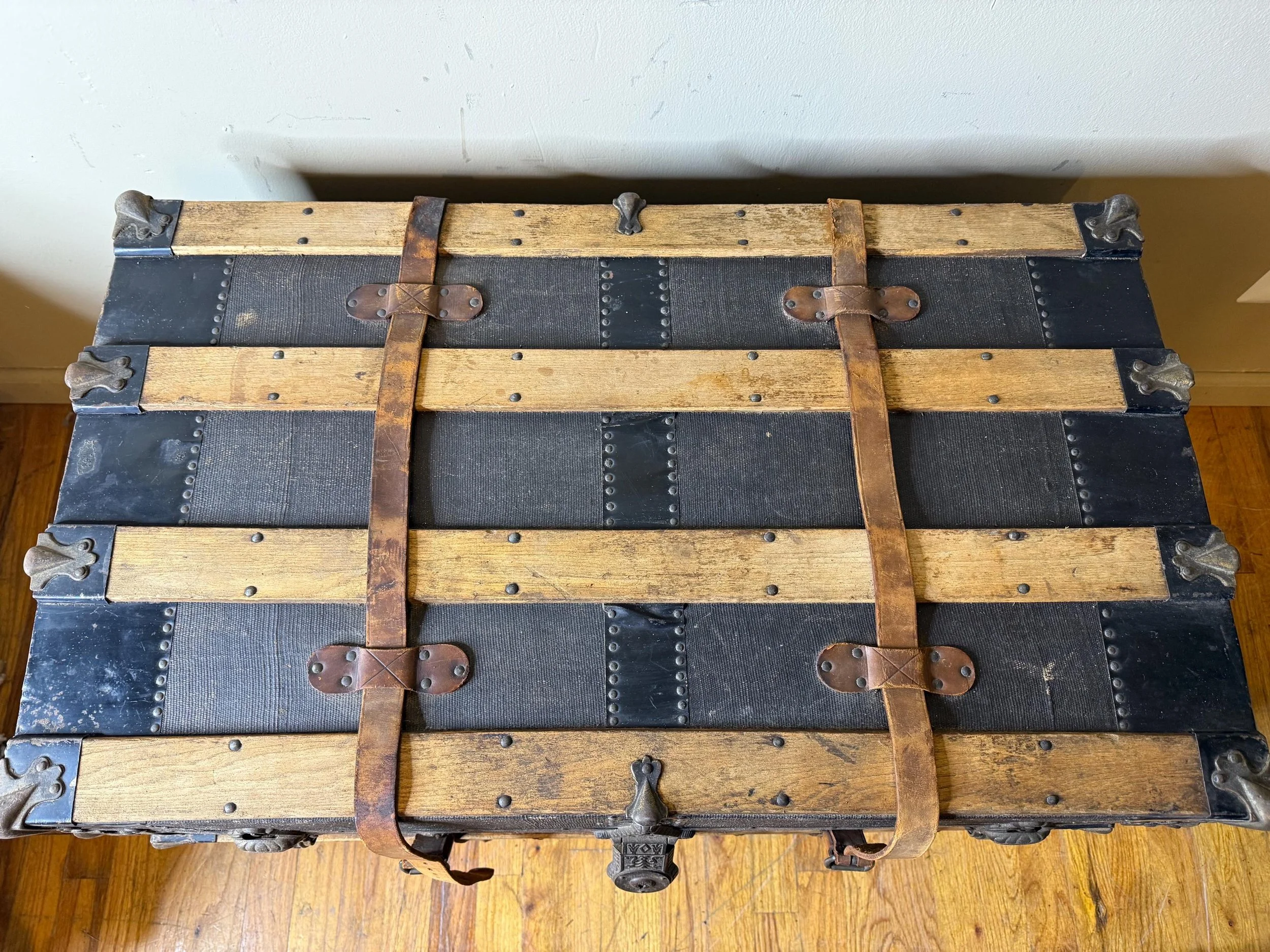 Large vintage blanket chest with hidden storage for living room linens.
