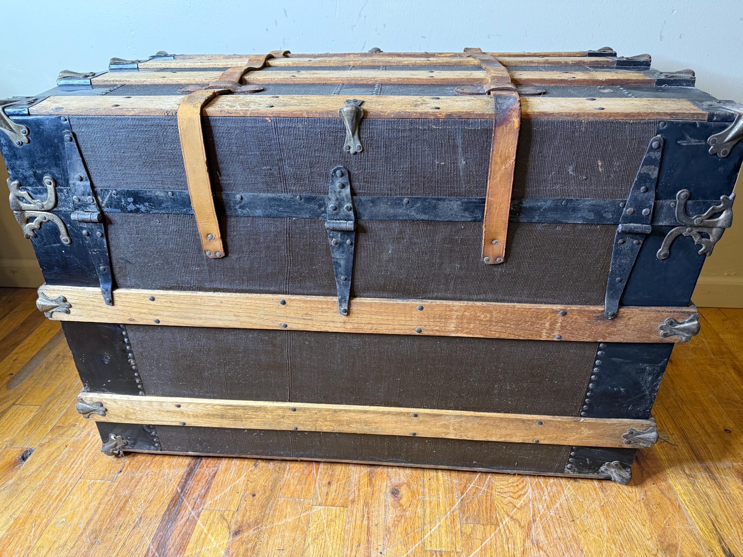 Hand-selected heritage storage chest for high-end industrial home decor.