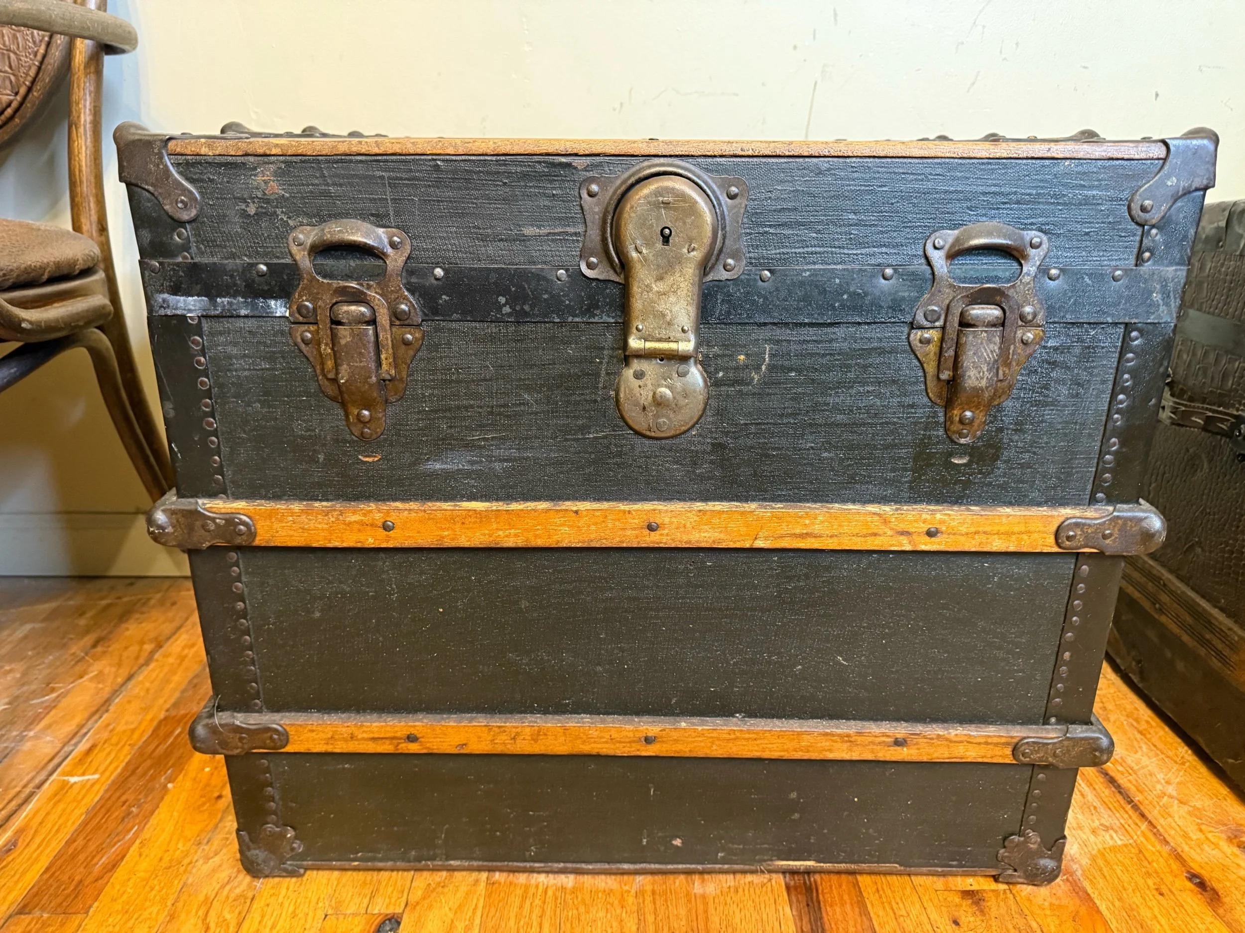 Antique trunk coffee table with brass hardware details