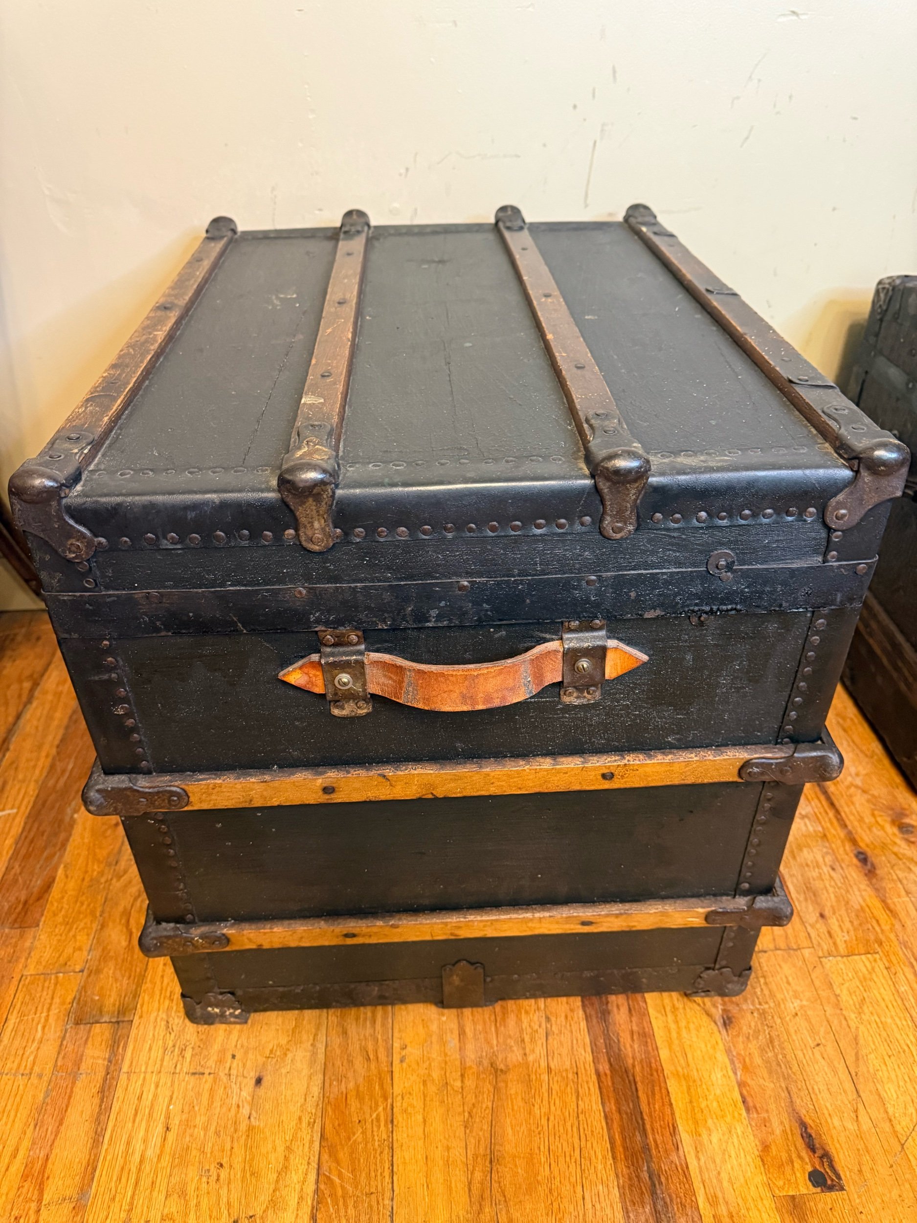 Original leather handle detail on antique steamer trunk