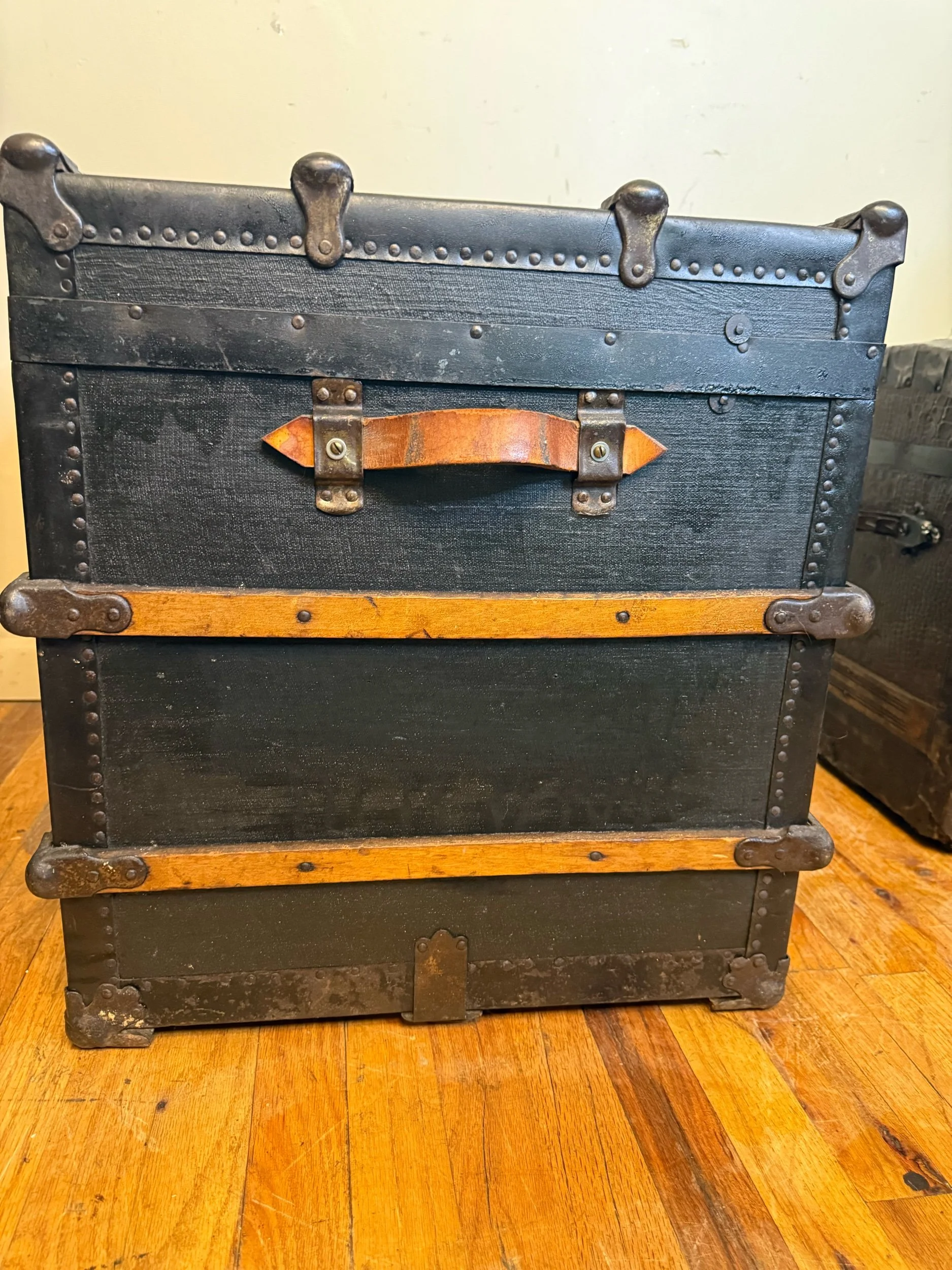 Side view of vintage travel trunk storage chest