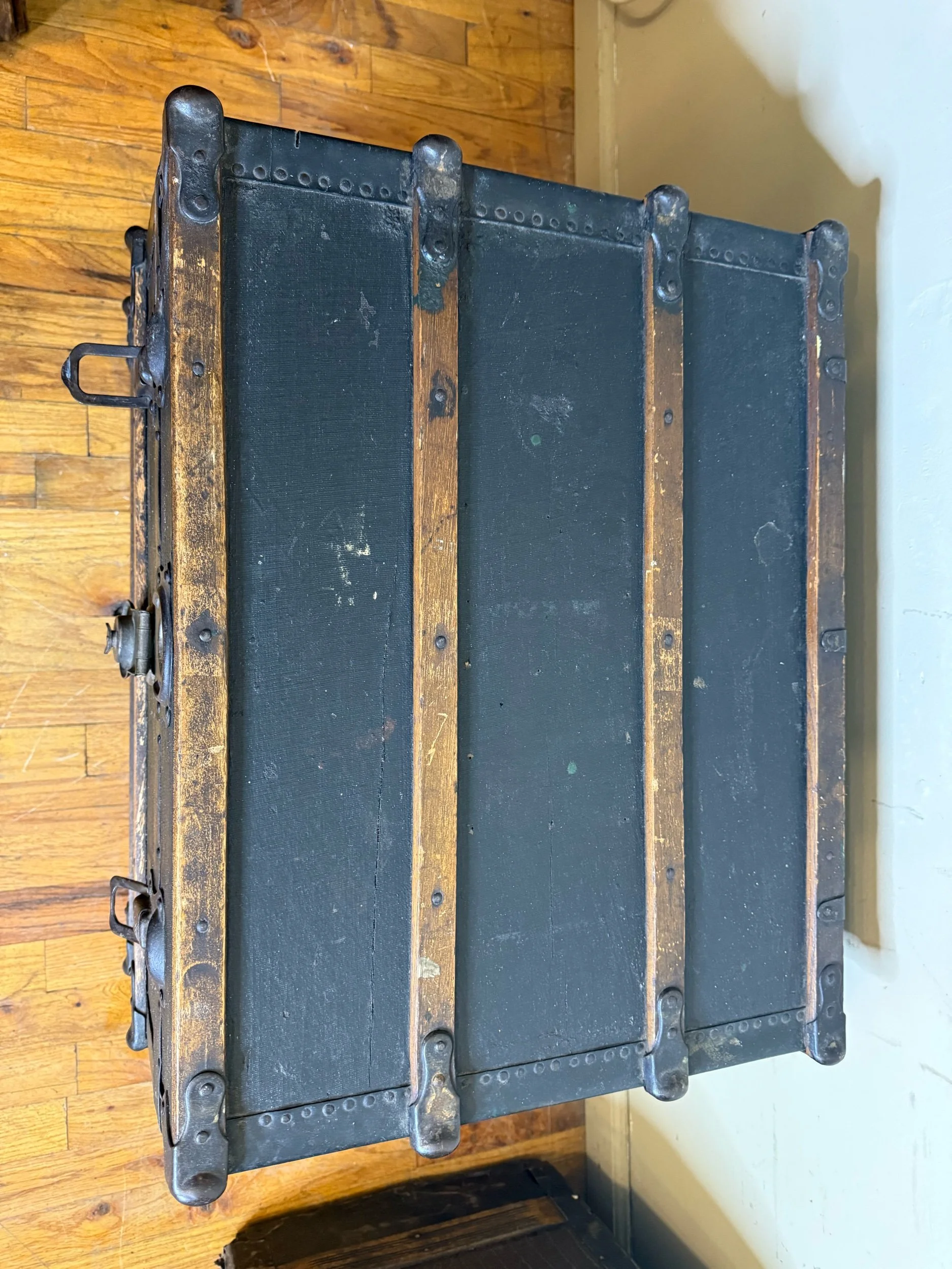 Close-up of original antique trunk hardware and tacks