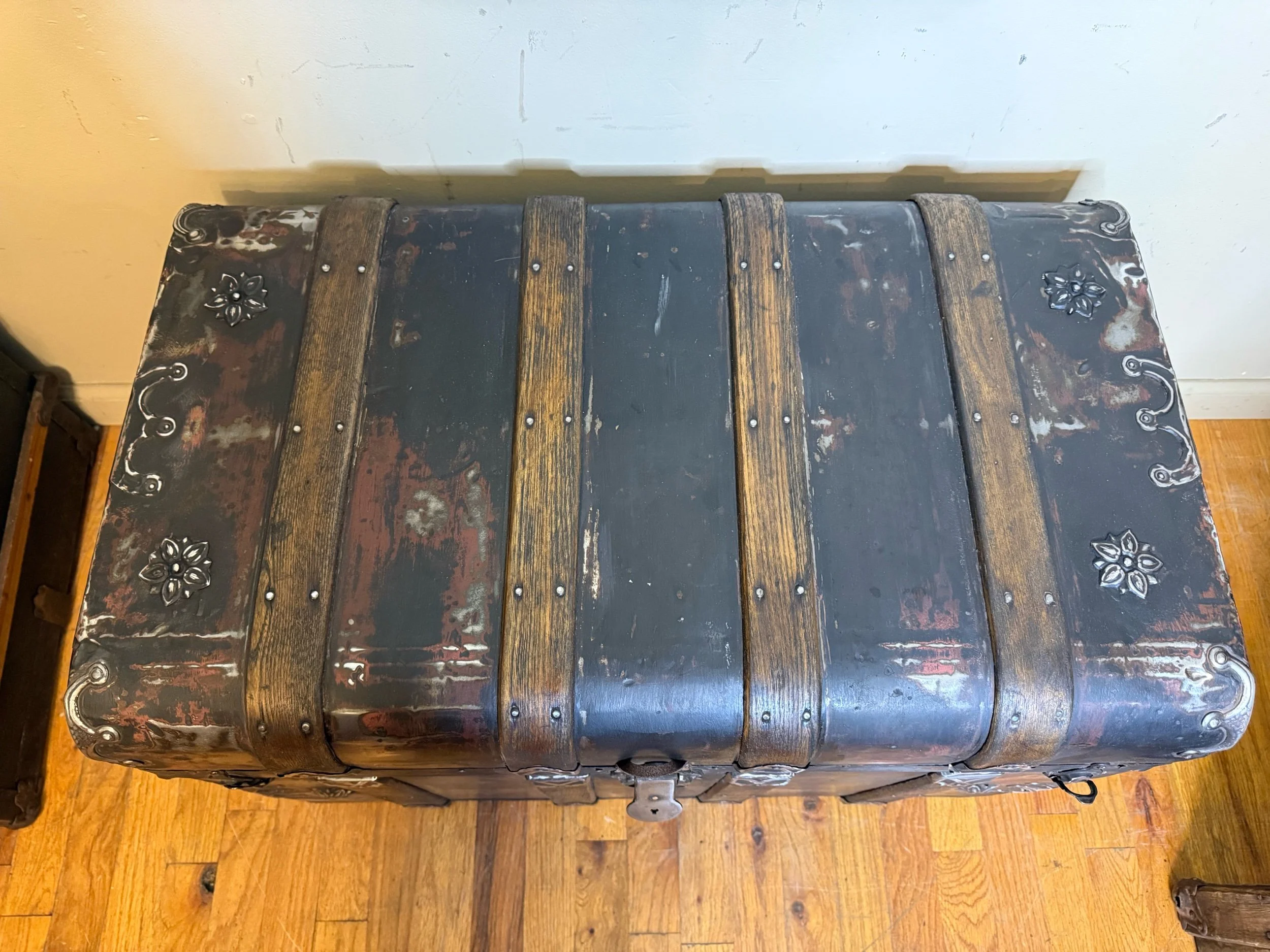 Refinished antique monitor trunk with walnut oak slats and original hardware