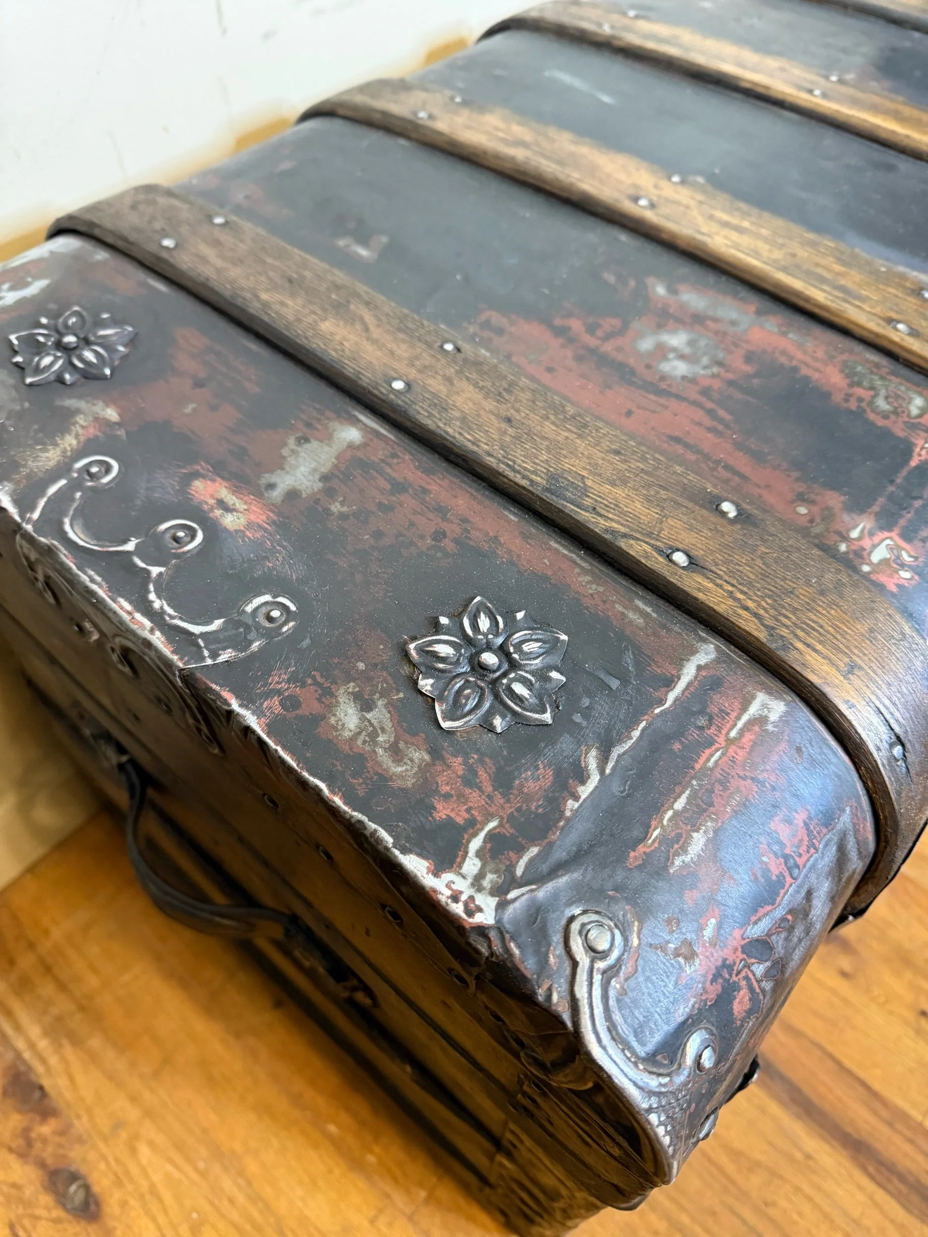 Late 1800s antique steamer trunk used as decorative storage chest