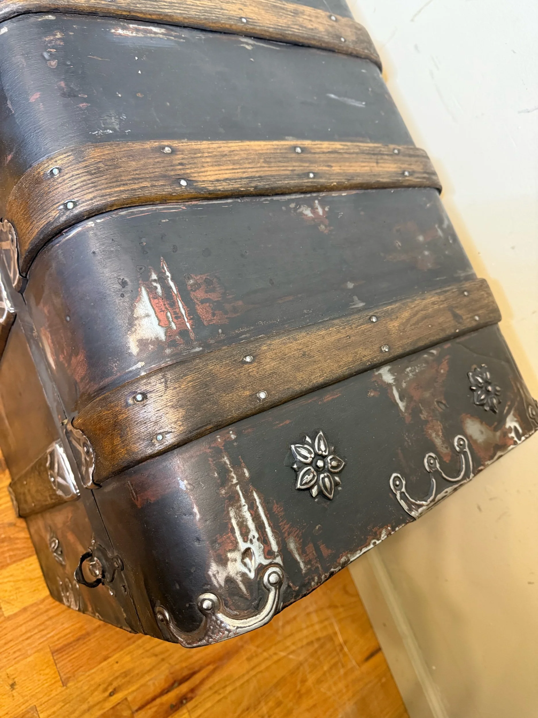 Antique blanket chest with refinished wood slats and metal bands