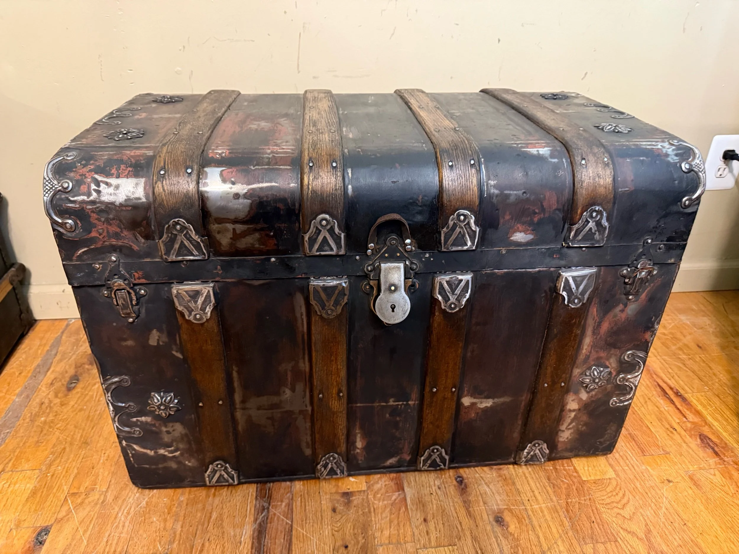 Antique trunk coffee table with waterfall front design