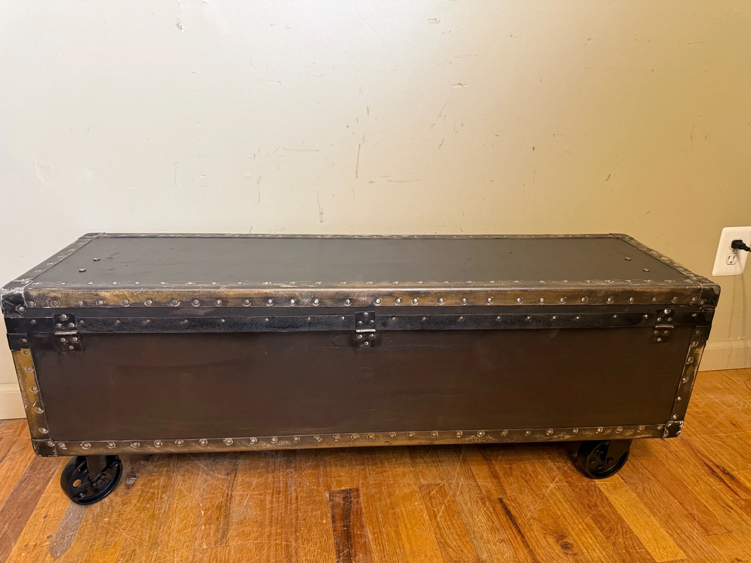 Low profile antique coffee table with hidden storage compartment
