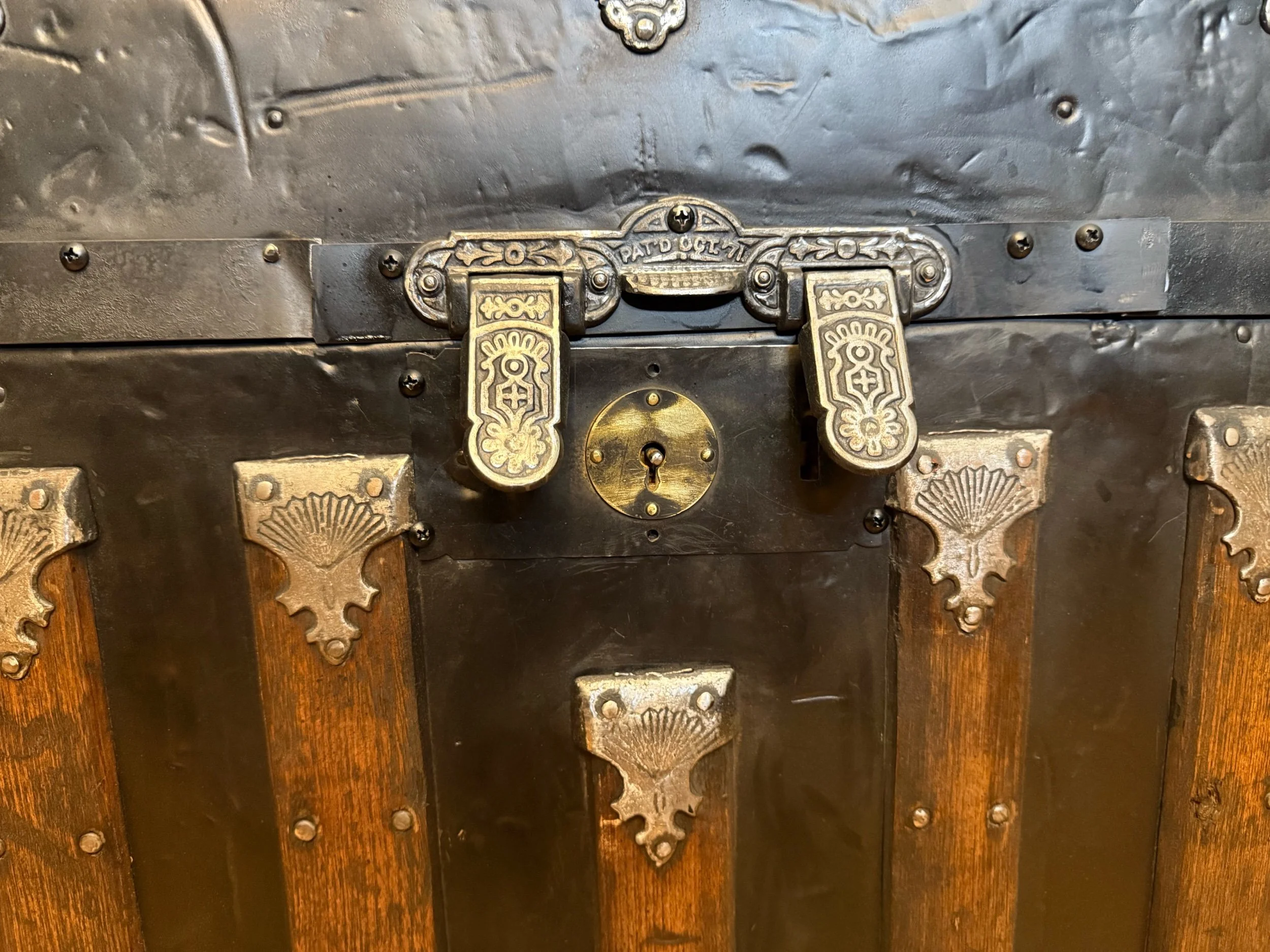 Ornate hardware on restored Saratoga antique trunk