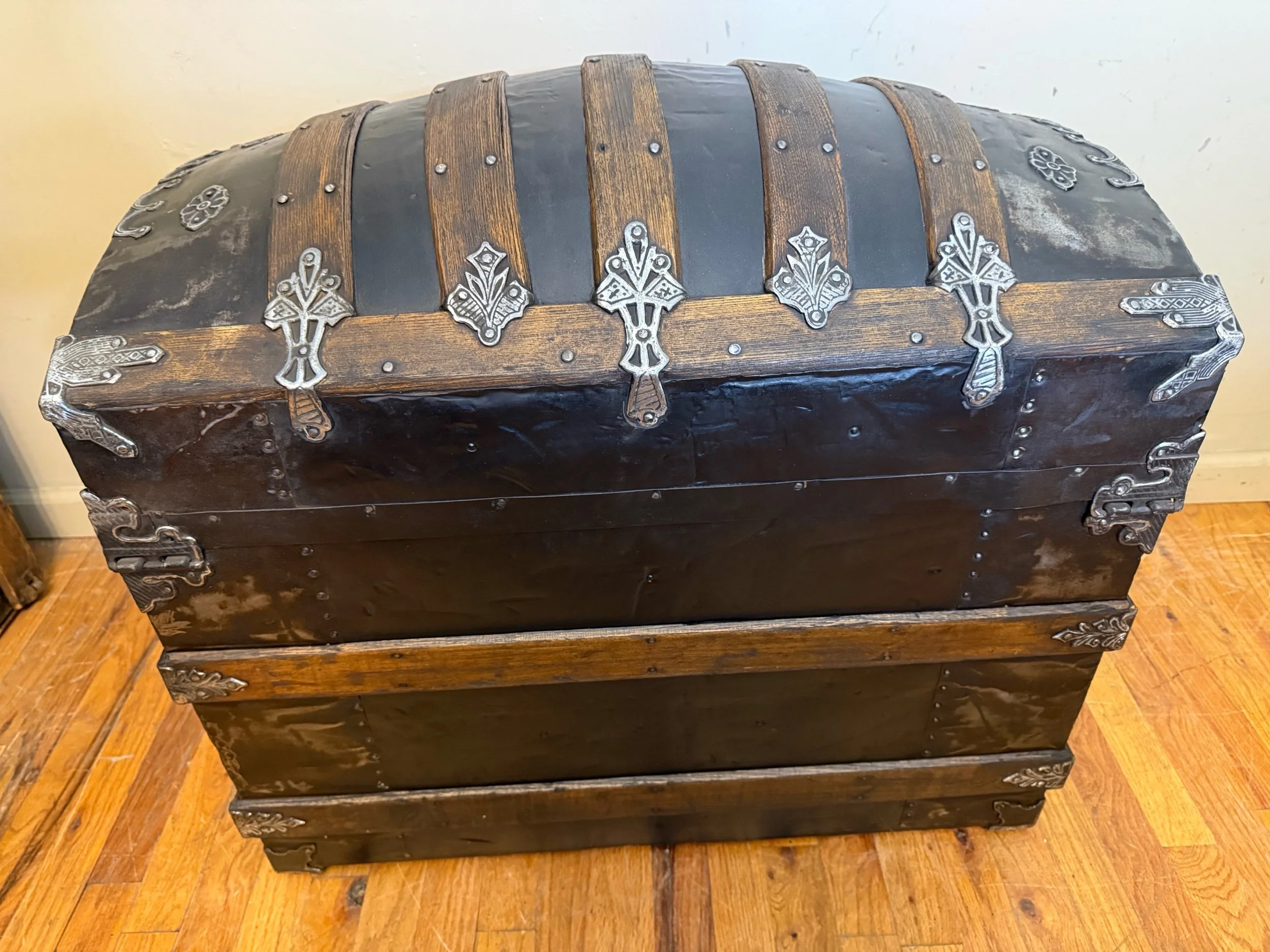 Historic American travel trunk with ornate hardware