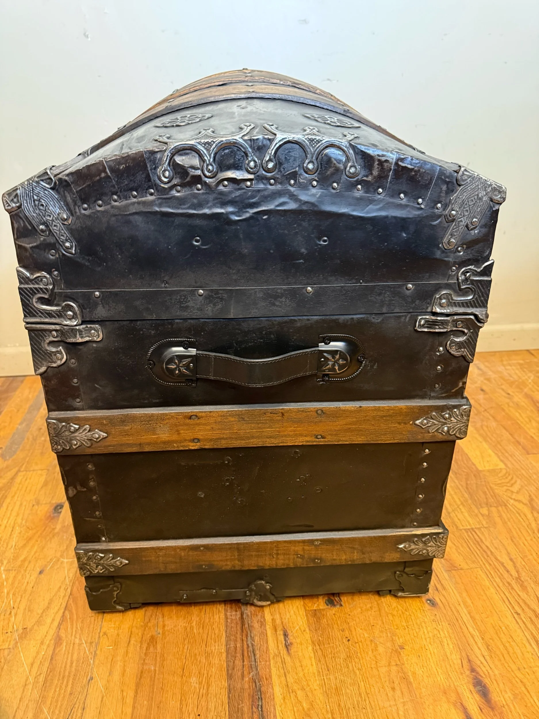 Side view of Victorian dome top steamer trunk