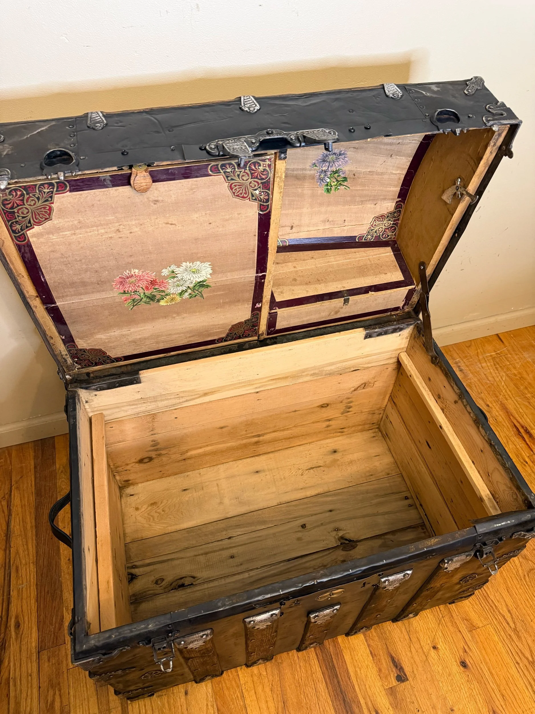 Sanded wood interior of antique Saratoga storage chest