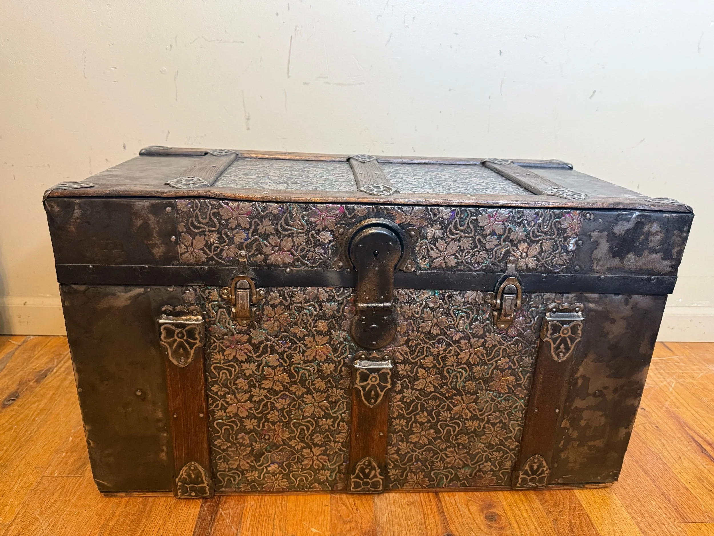 Rare embossed tin antique steamer trunk with flat top coffee table design