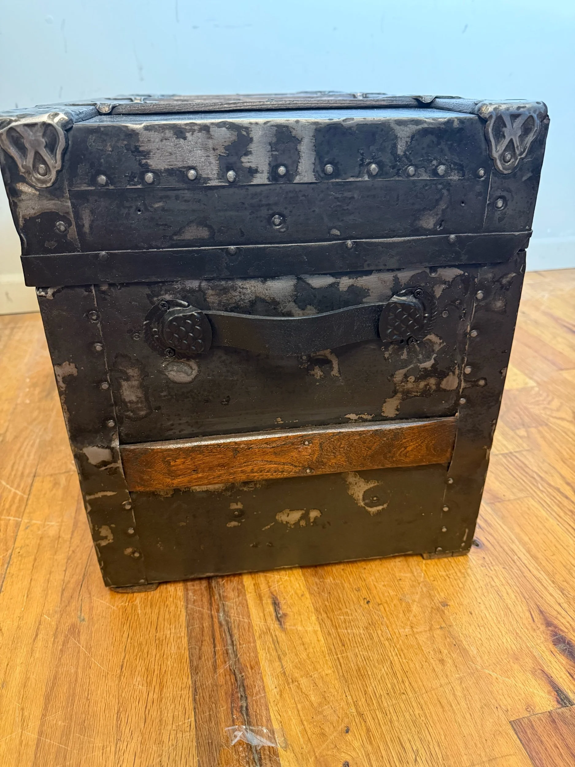 Custom black leather handle on restored antique trunk