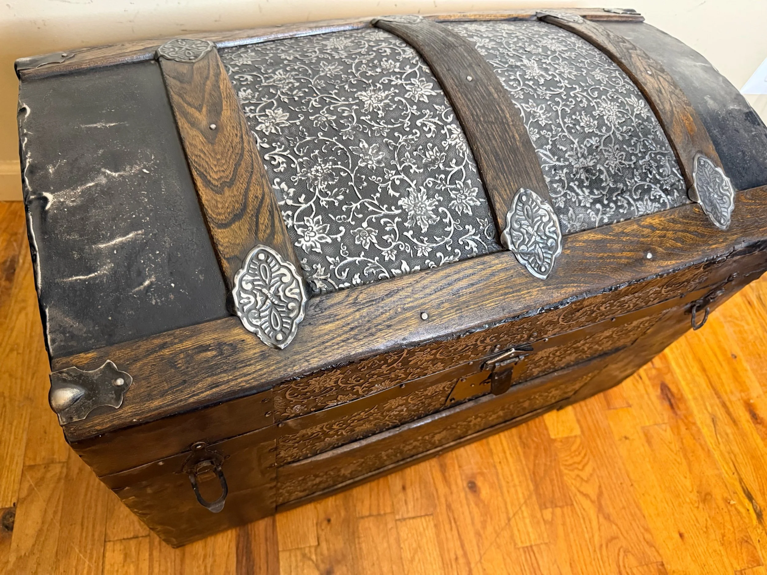 Victorian Saratoga antique steamer trunk with embossed tin dome top