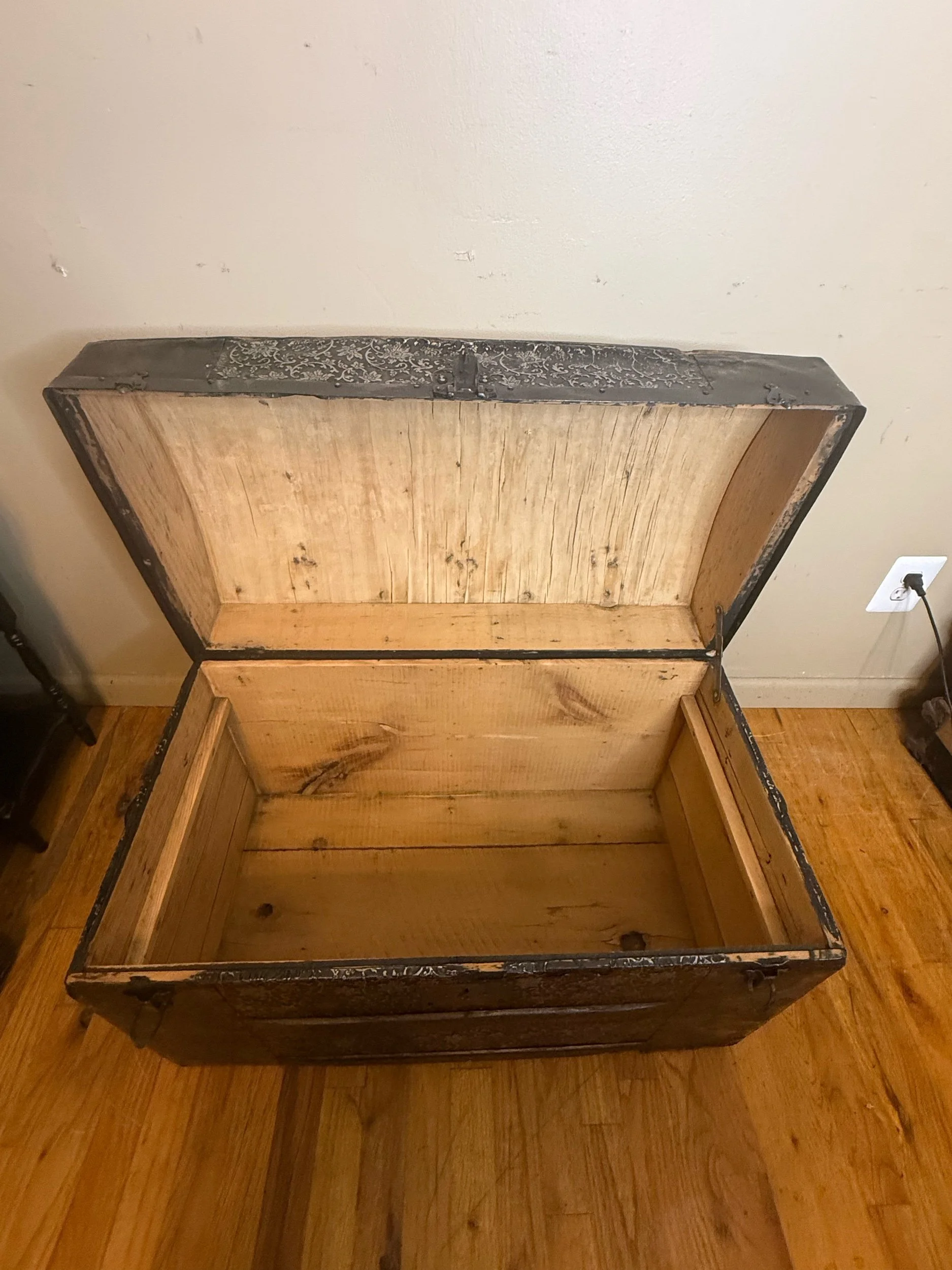 Freshly stripped and sanded wood interior of antique trunk