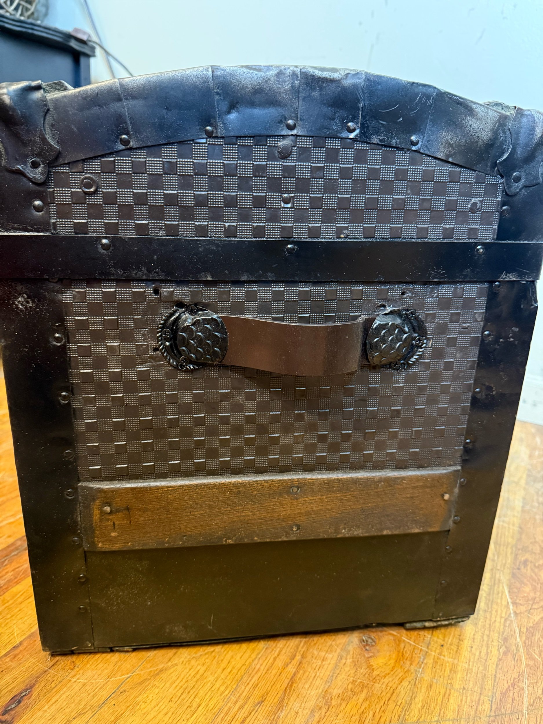 Side view of Victorian dome top antique steamer trunk