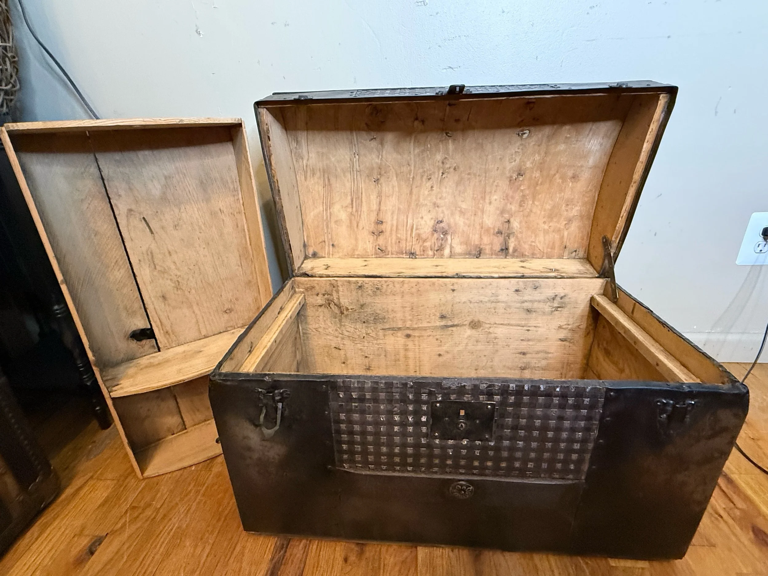 Clean sanded wood interior of antique Saratoga trunk