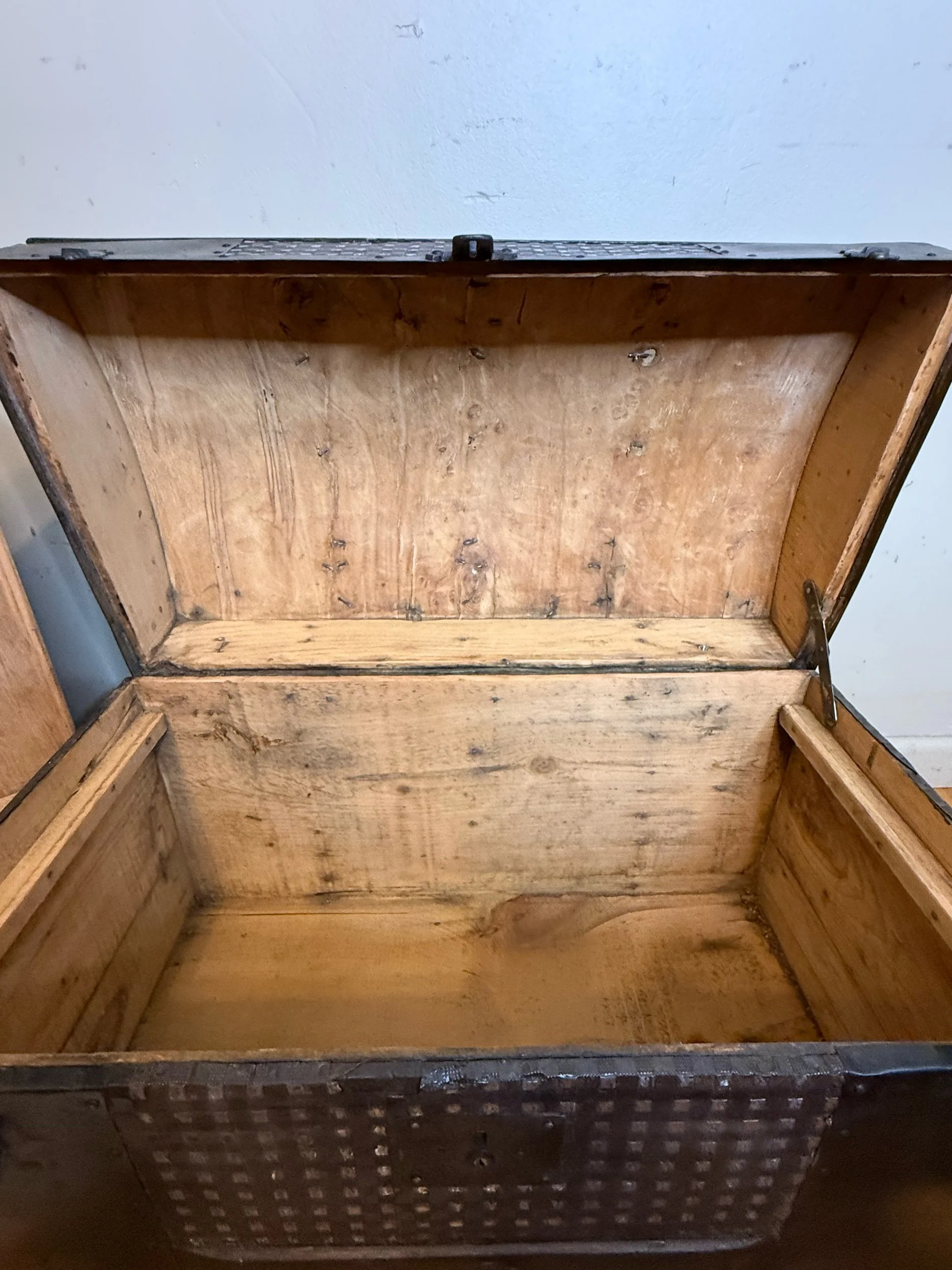 Sanded antique trunk interior with natural wood grain