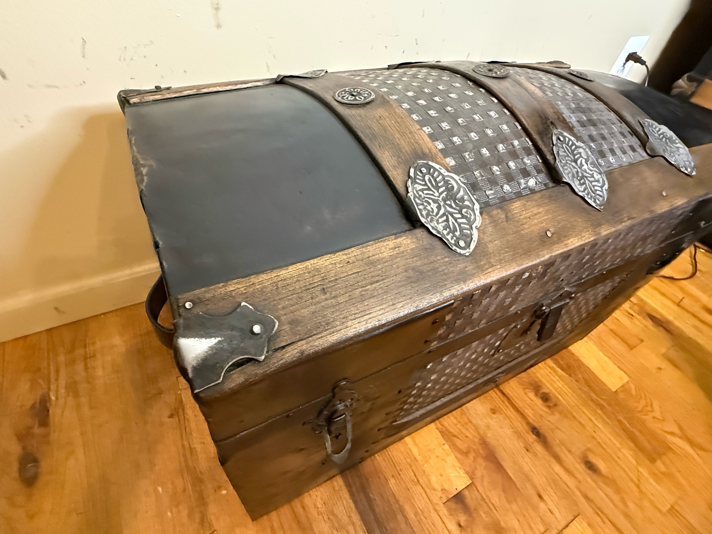 Walnut stained wood slats on antique Saratoga steamer trunk