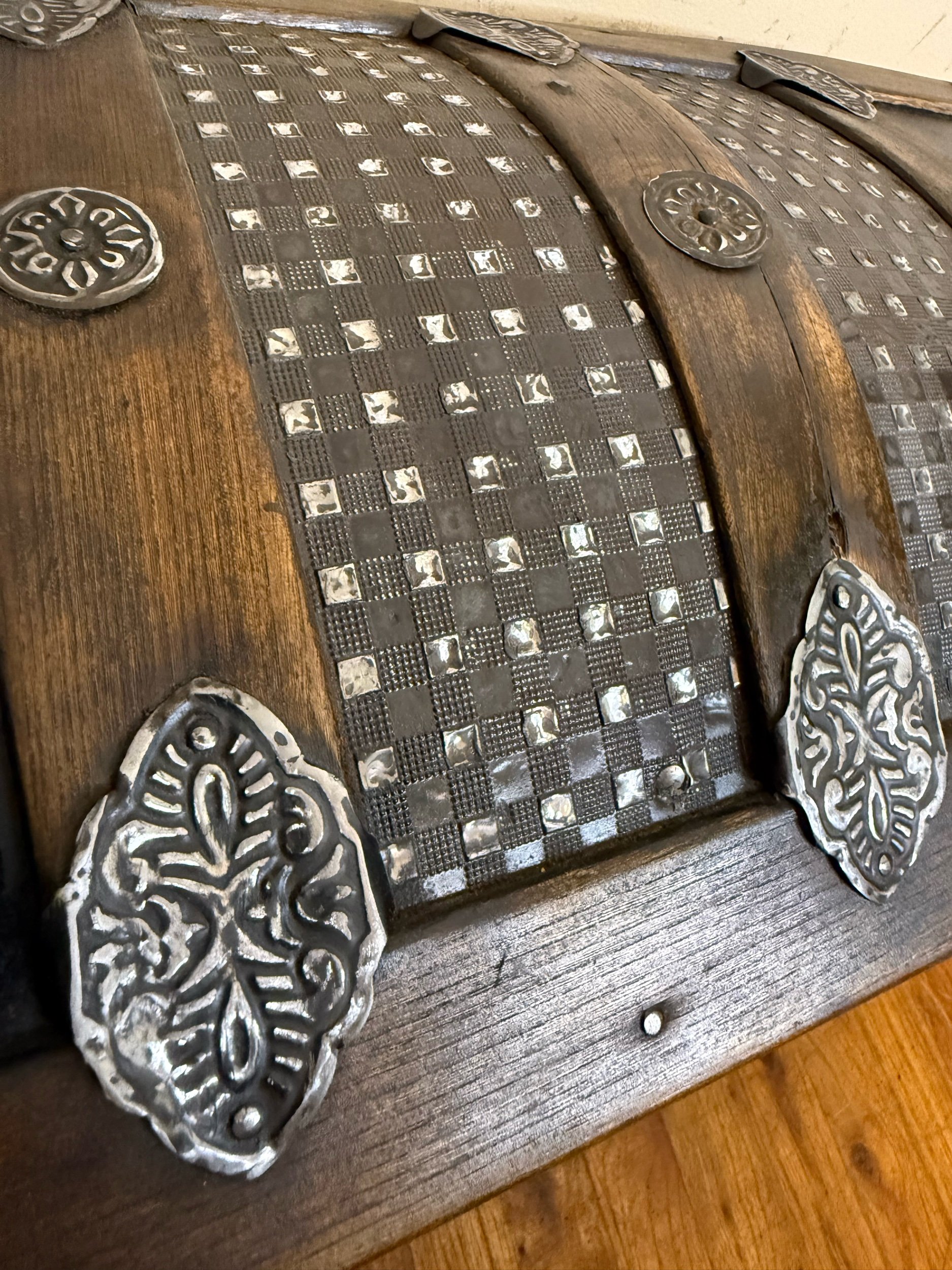 Buffed embossed metal pattern on Victorian antique trunk