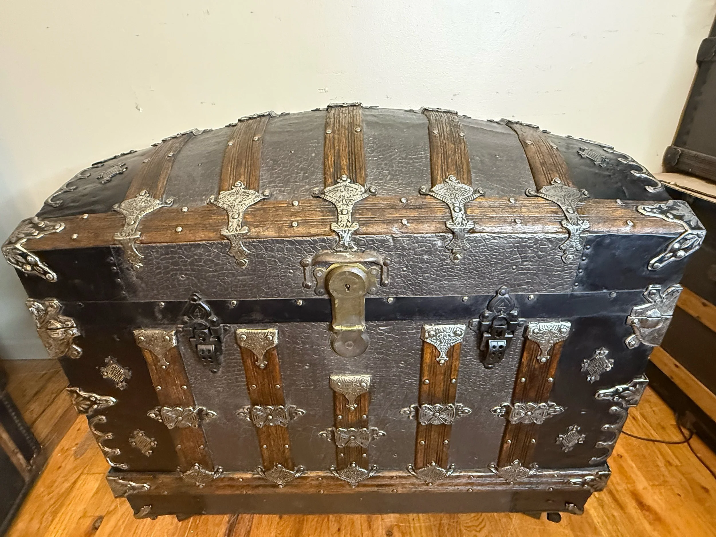 Late 1800s dome top trunk with crocodile pattern embossed tin