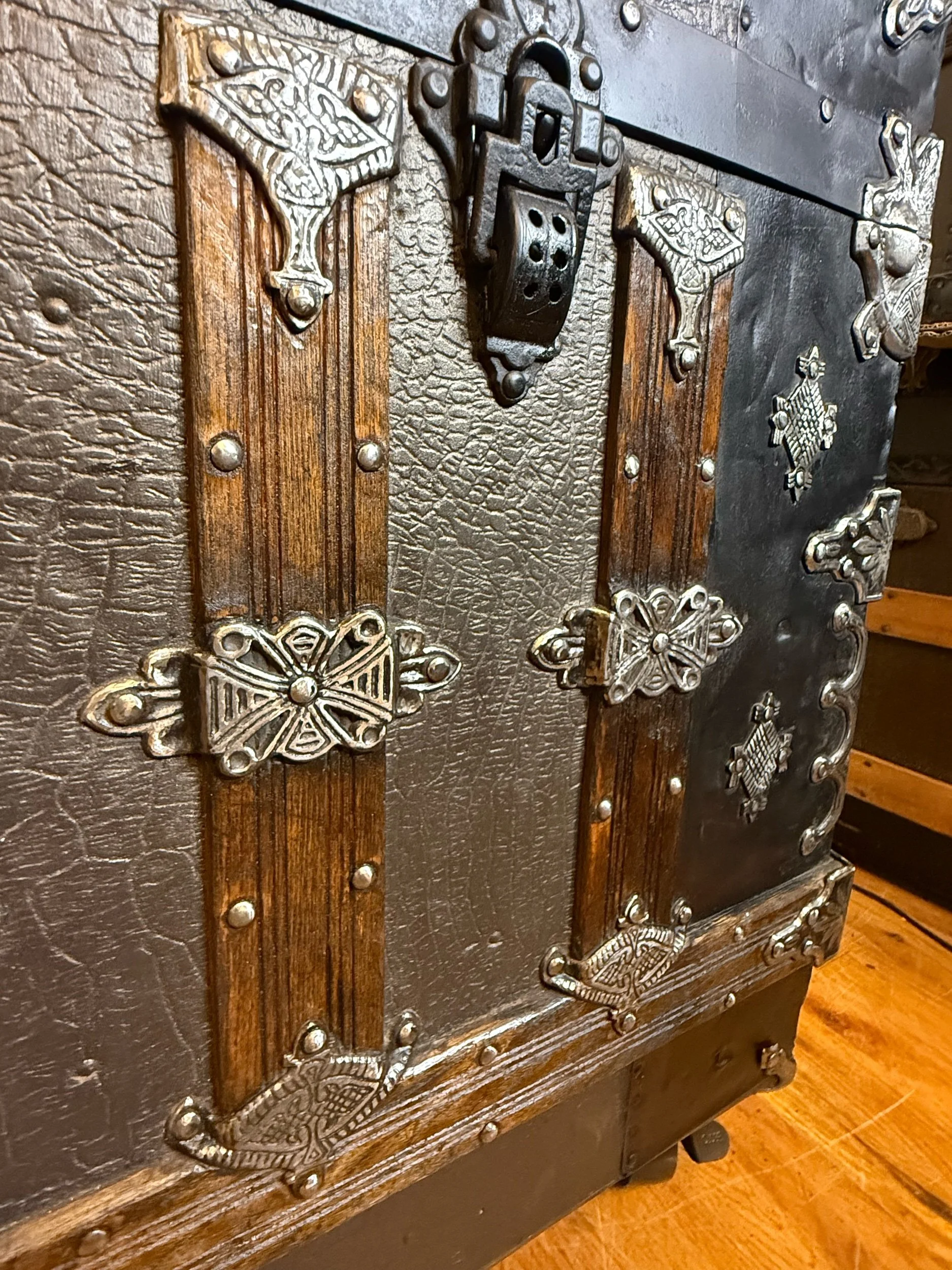 Victorian humpback trunk with ornate antique hardware